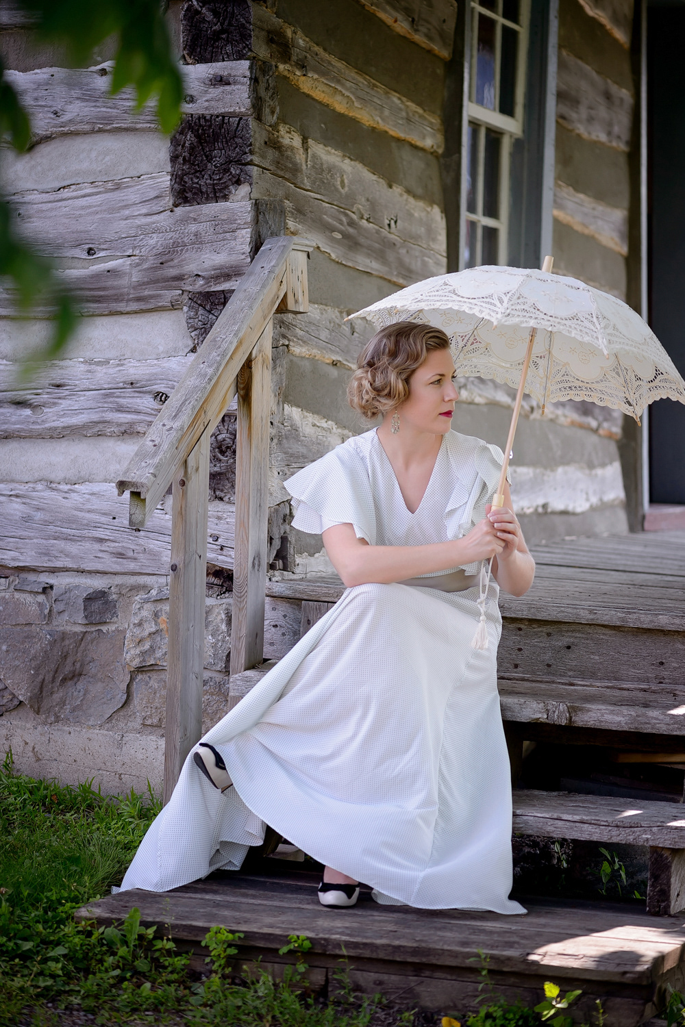 A 1930s-inspired gown in rayon. This elegant evening gown, inspired by the starlets of the 1930s, is cut on the bias with draped flowing sleeves and a light flowing skirt.
