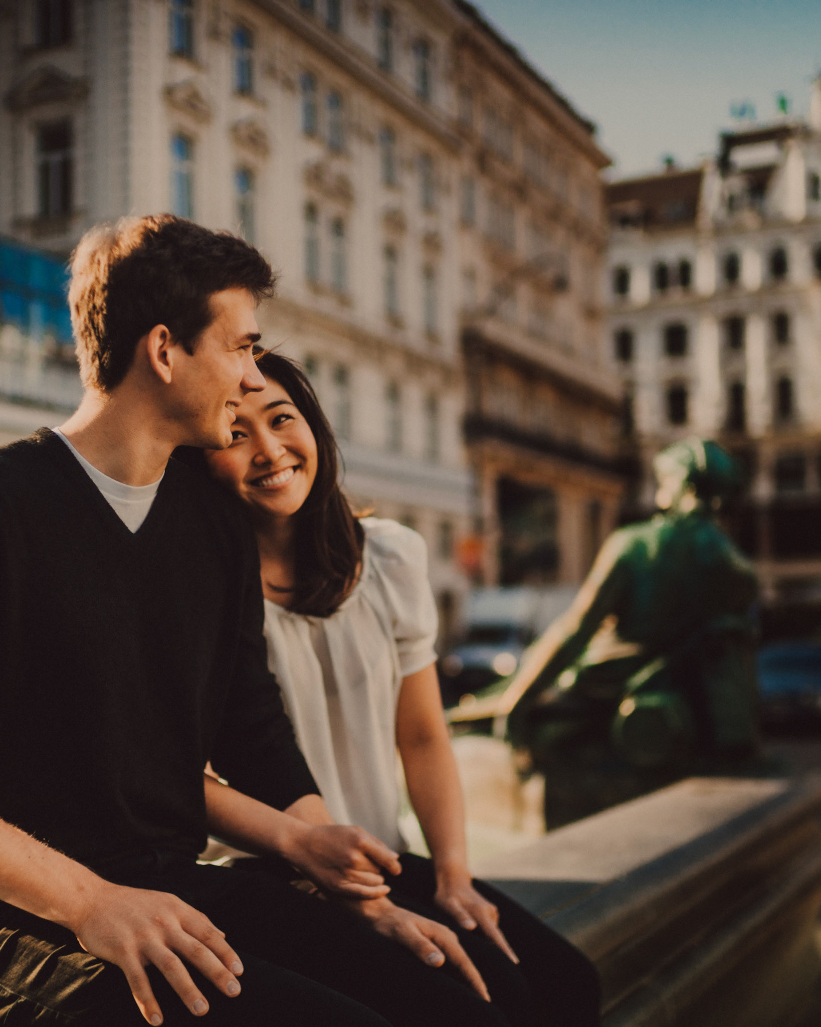 Casual and filmic destination engagement photos inspired by "Before Sunrise" movie locations, Donnerbrunnen fountain at Neuer Markt Square, Innere Stadt, Vienna, Austria, August 2017, Sony A7RII.