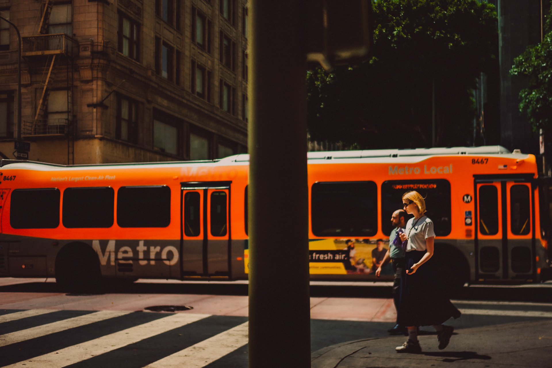 A bright orange LA Metro Bus, Los Angeles, California, USA, July 2018, Leica M.