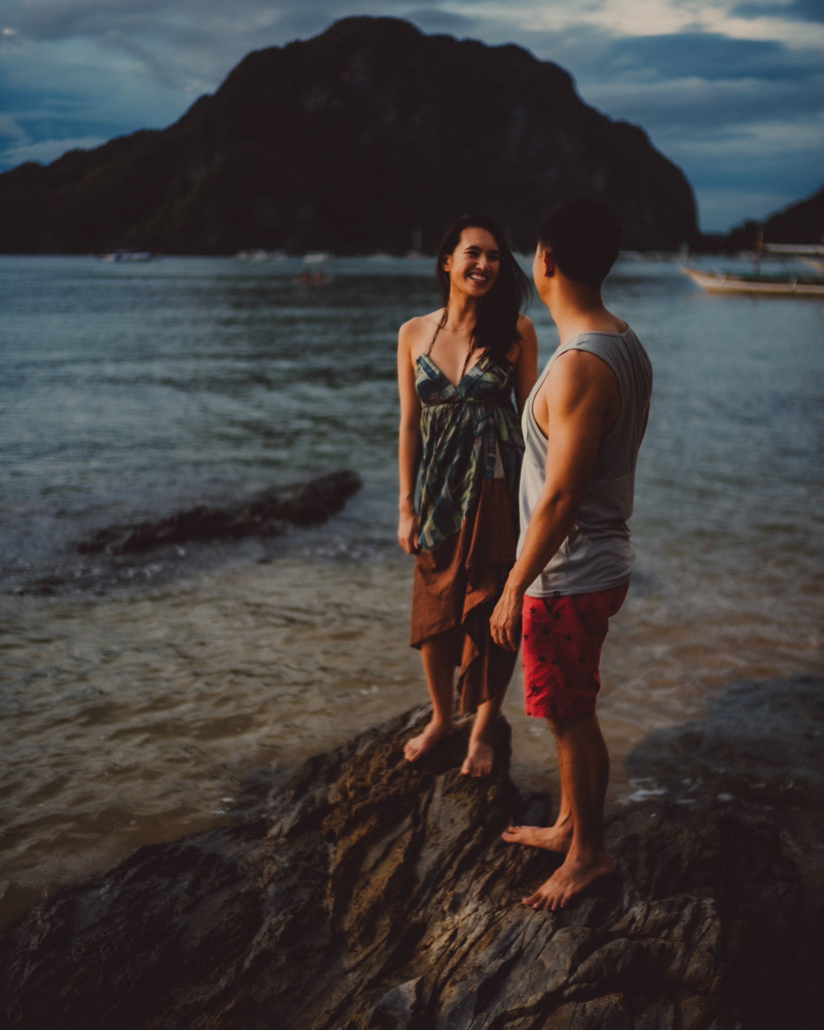 Blue hour couple portraits on a rocky coast, just below Republica Sunset Bar, from George and Allie's honeymoon portrait shoot, Corong-Corong Beach, El Nido, Palawan, Philippines, Southeast Asia, December 2018, Sony A7III