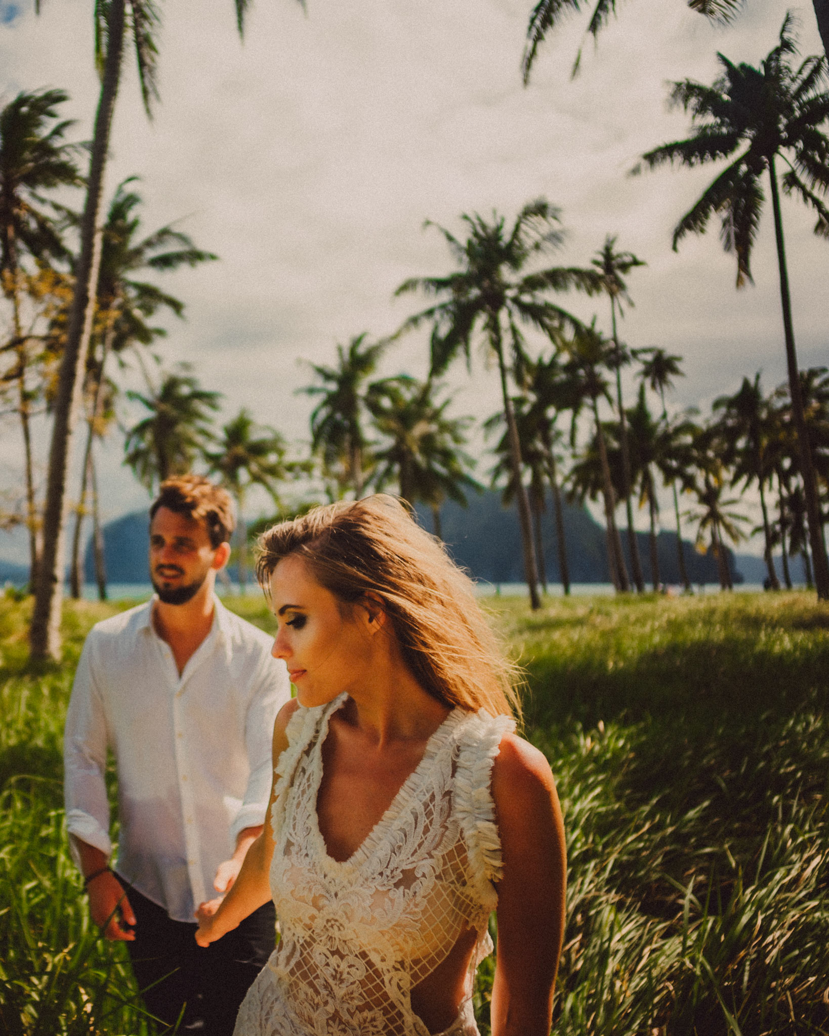 Moody portraits with knee-high cogon grass and coconut trees in the background, Pinagbuyutan Island, El Nido, Palawan, Philippines, Southeast Asia, December 2019, Sony A7III.
