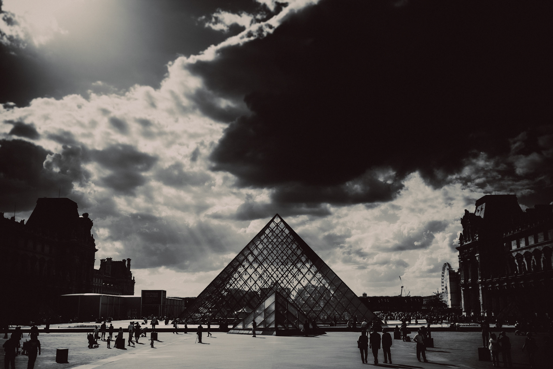 Pyramide du Louvre against a moody sky, in black and white, Paris, France, July 2015, Leica M.