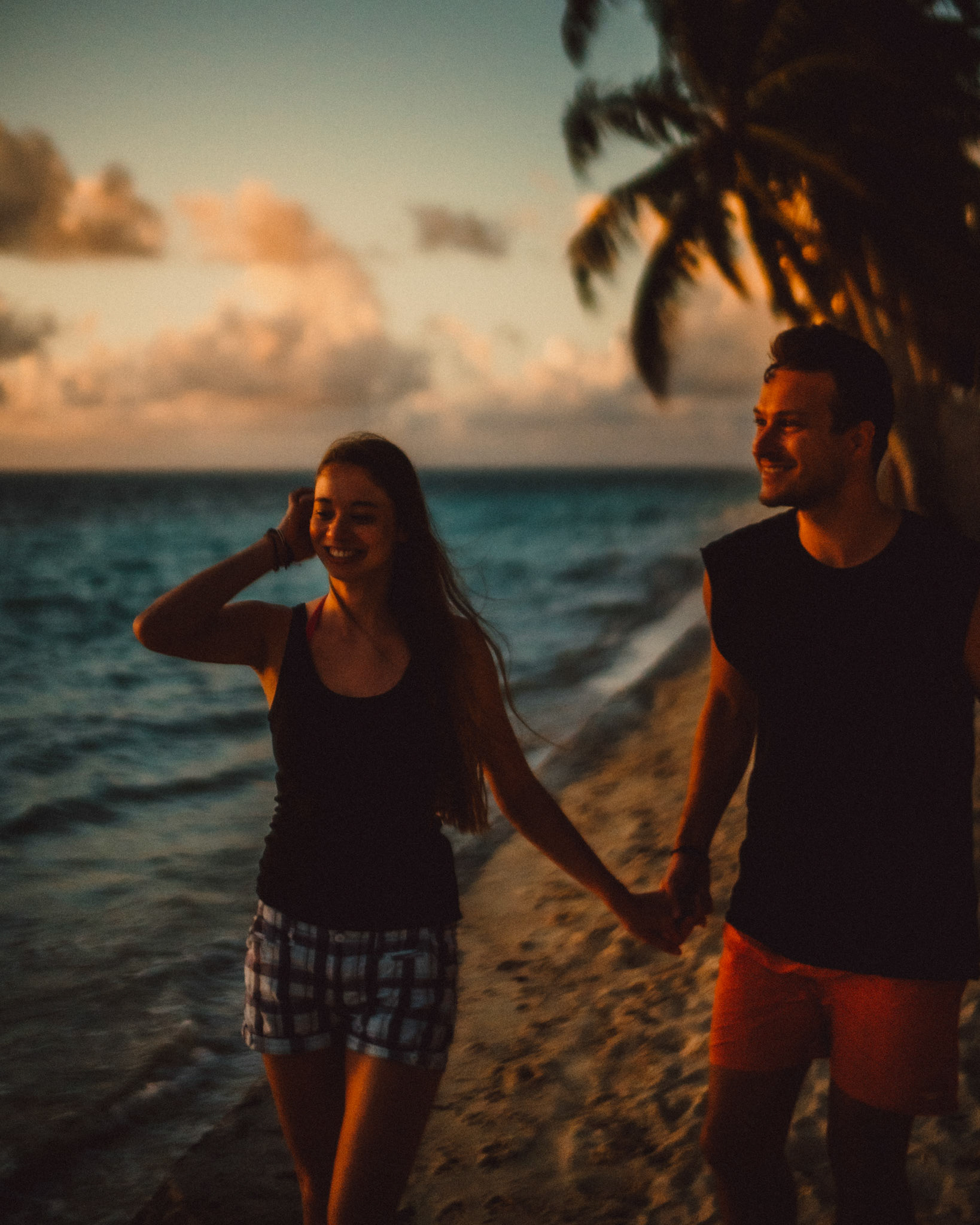 Candidly walking on an empty beach just moments after sunrise, General Luna, Siargao Island, Philippines, Southeast Asia, March 2019, Sony A7III.