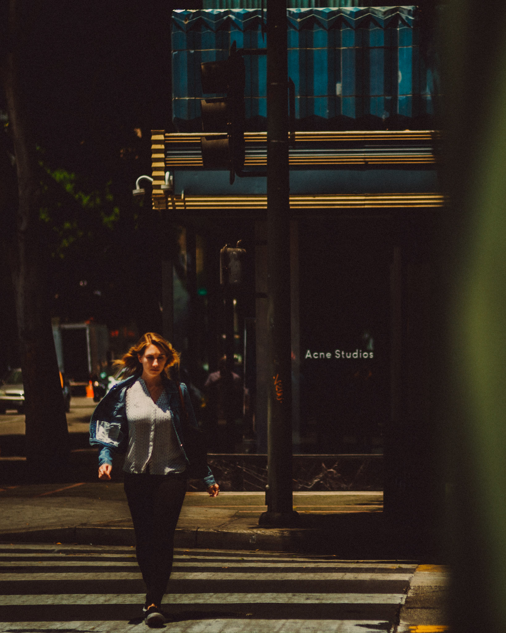A female pedestrian crossing from ACNE Studios, Los Angeles, California, USA, July 2018, Leica M.