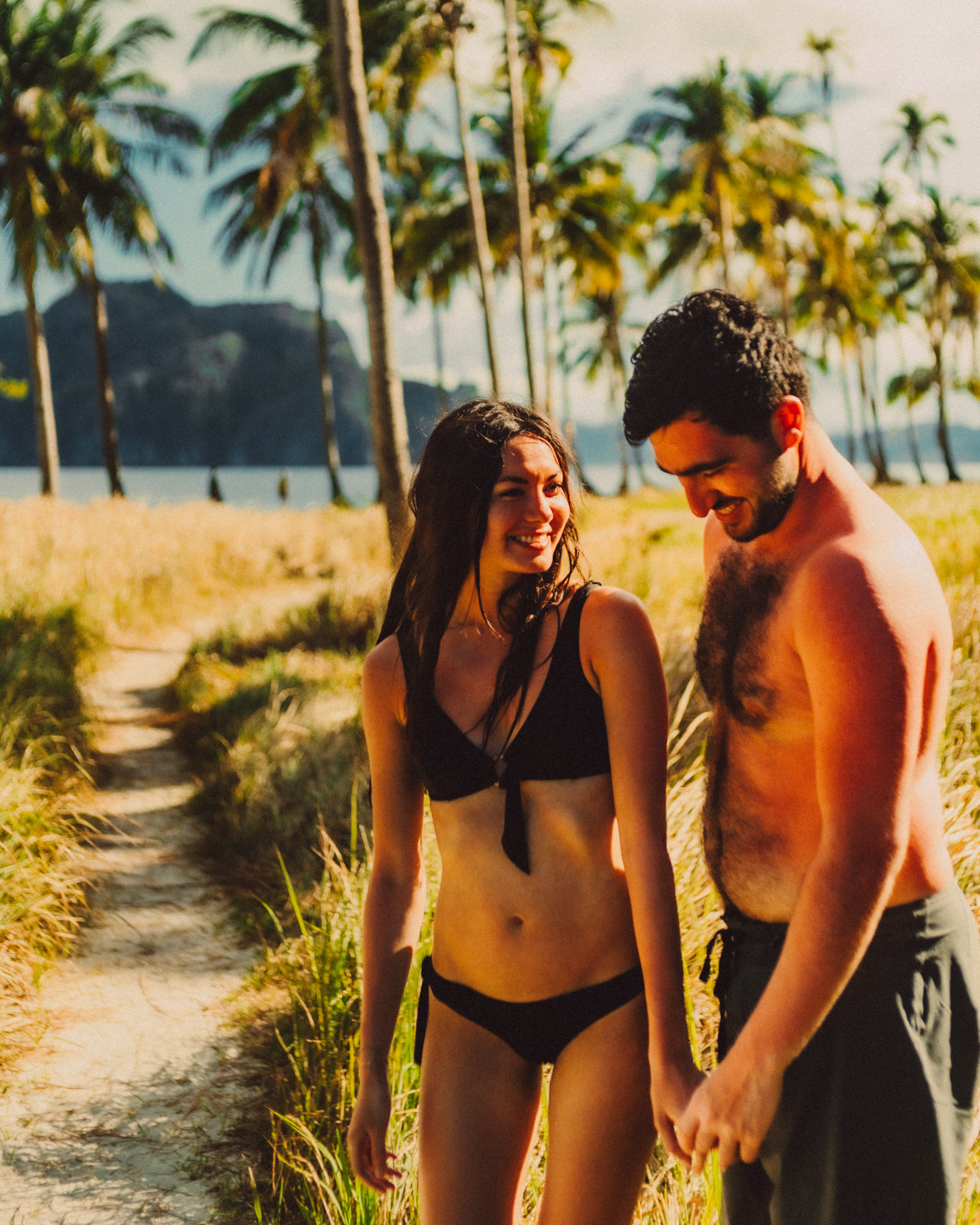 Chill couple portraits with palm trees in the background, Pinagbuyutan Island, El Nido, Palawan, Philippines, Southeast Asia, March 2020, Sony A7III.