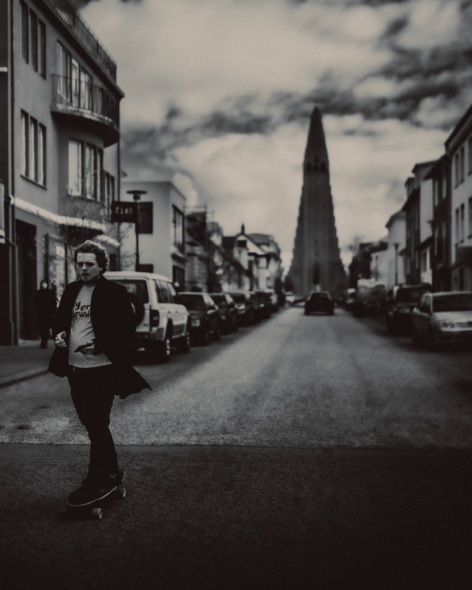 Skateboarding along Skólavörðustígur with Hallgrímskirkja in the background, Reykjavík, Iceland, May 2016, Leica M.