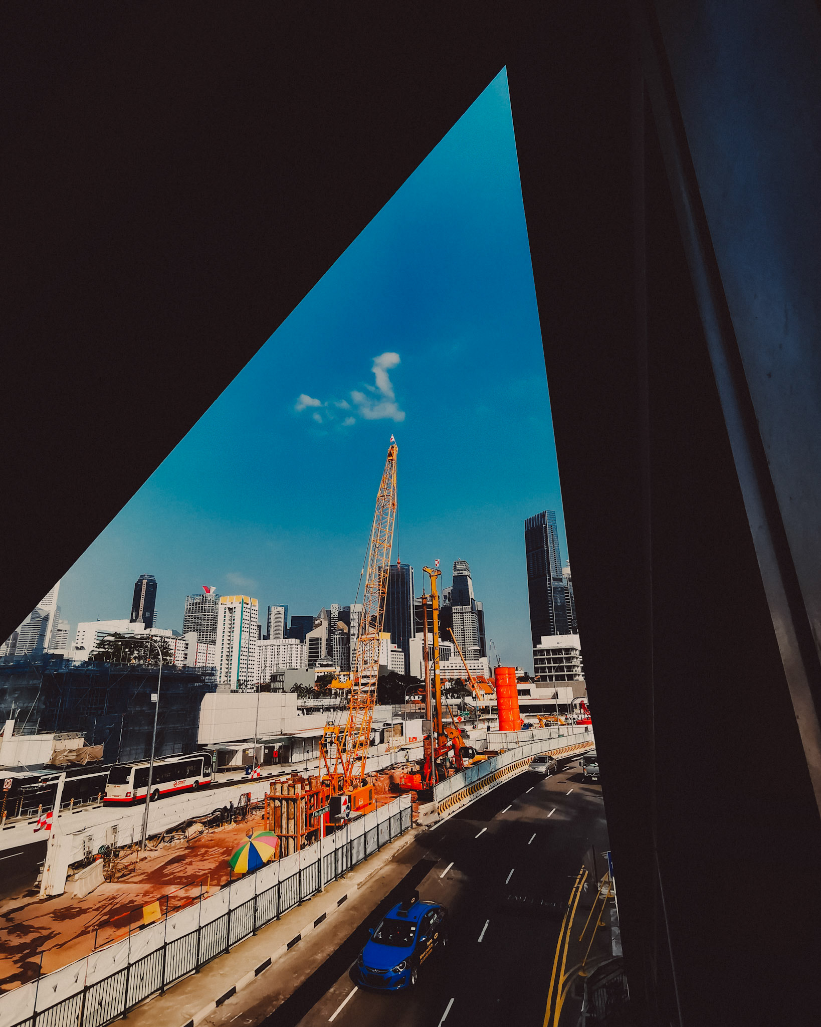 A construction site and the central business district skyline inside a triangular frame, Singapore, March 2019, Huawei Mate 20 Pro.