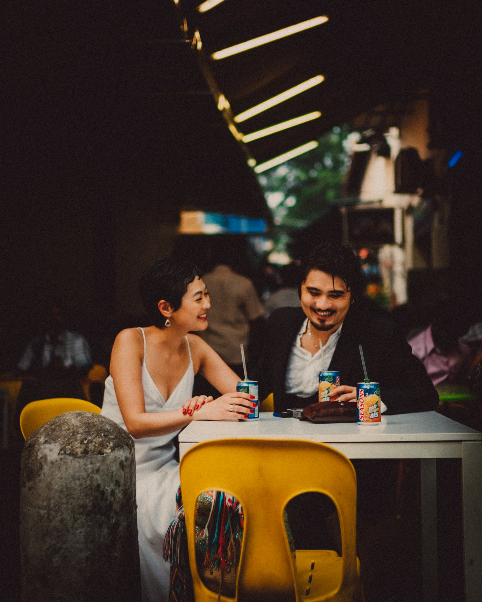 A Japanese couple enjoying a Sunday afternoon in an Indian food stall near Mustafa Centre, from Ibuki and Emi's candid chill engagement shoot in Little India, Singapore, October 2015, Sony A7S.