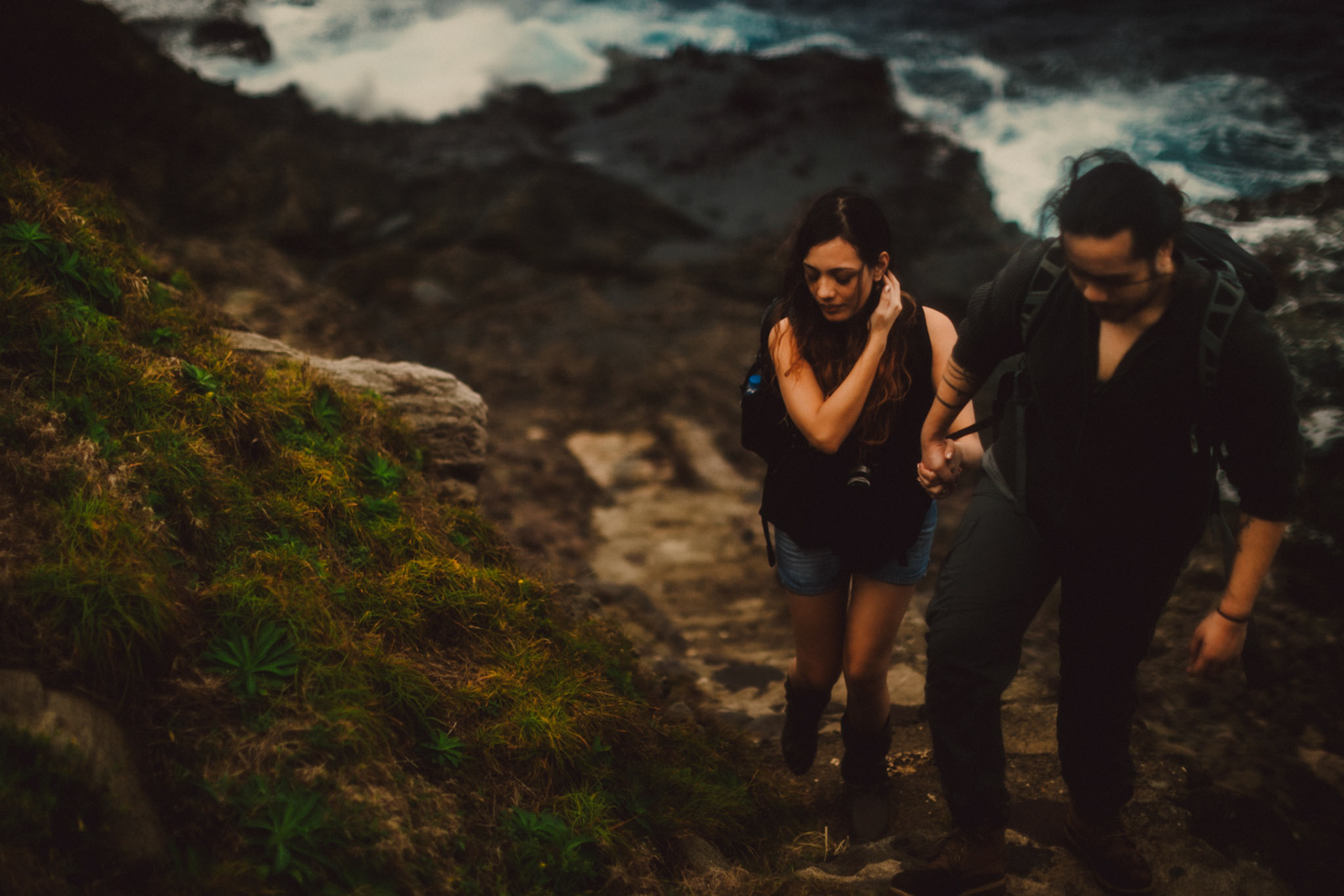 Moody backpacker couple portraits on a rocky cliff below Chawa View Deck in Mahatao, Batanes, Philippines, Southeast Asia, November 2014, Canon EOS 6D.