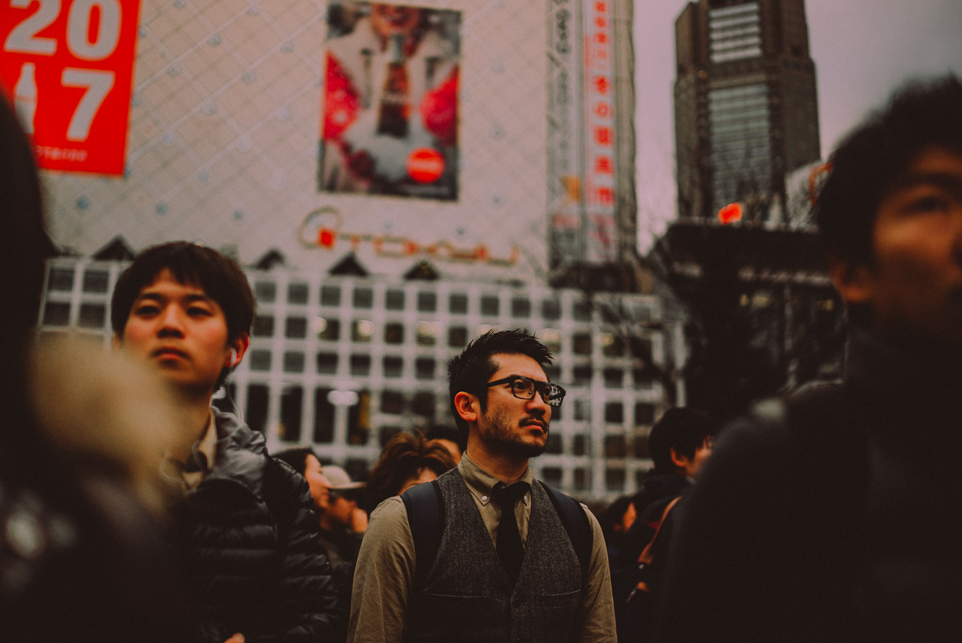 A pedestrian wearing eyeglasses in Shibuya Crossing, Tokyo, Japan, December 2016, Leica M.