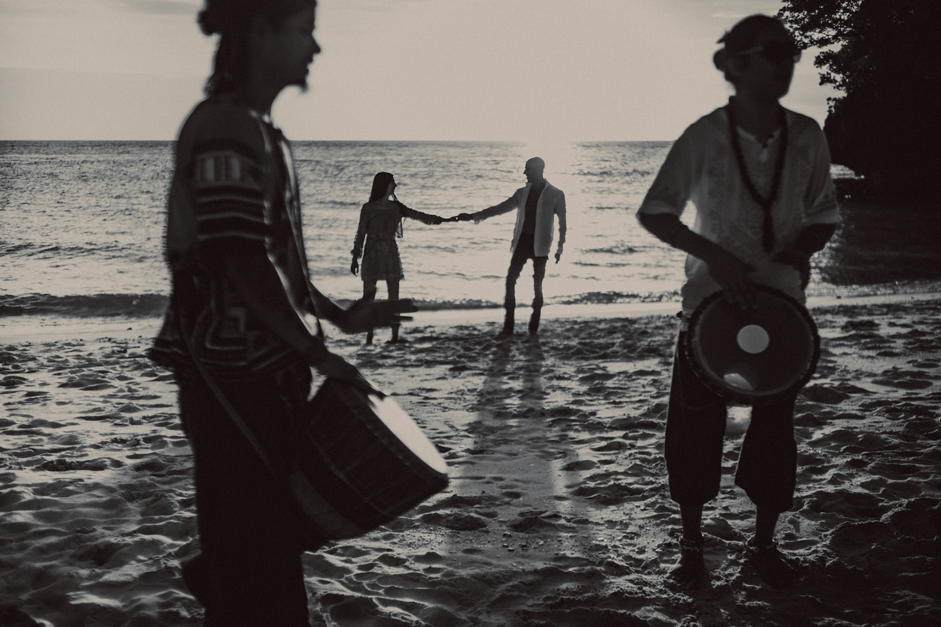Sunset destination couple portraits at Punta Bunga Beach, in black and white, with local percussionists at Crimson Resort and Spa, Boracay, Philippines, Southeast Asia, December 2018, Sony A7III.