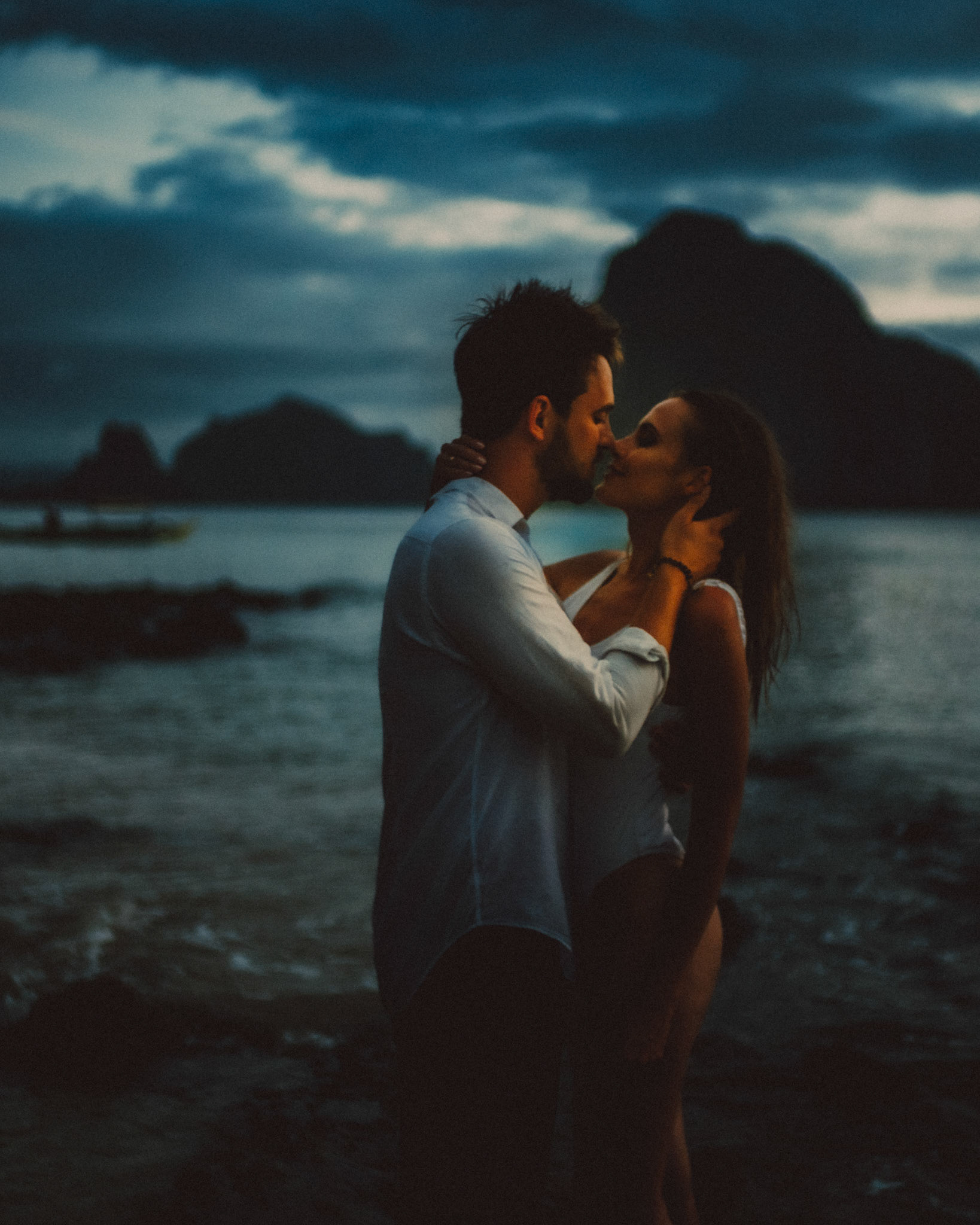 Moody and intimate couple portraits during blue hour in Las Cabanas Beach, El Nido, Palawan, Philippines, Southeast Asia, December 2019, Sony A7III.