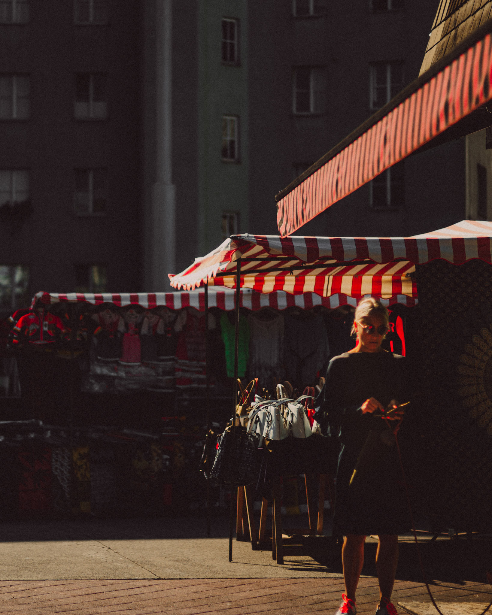 A woman in sunglasses, Naschmarkt, Vienna, Austria, August 2017, Leica M.