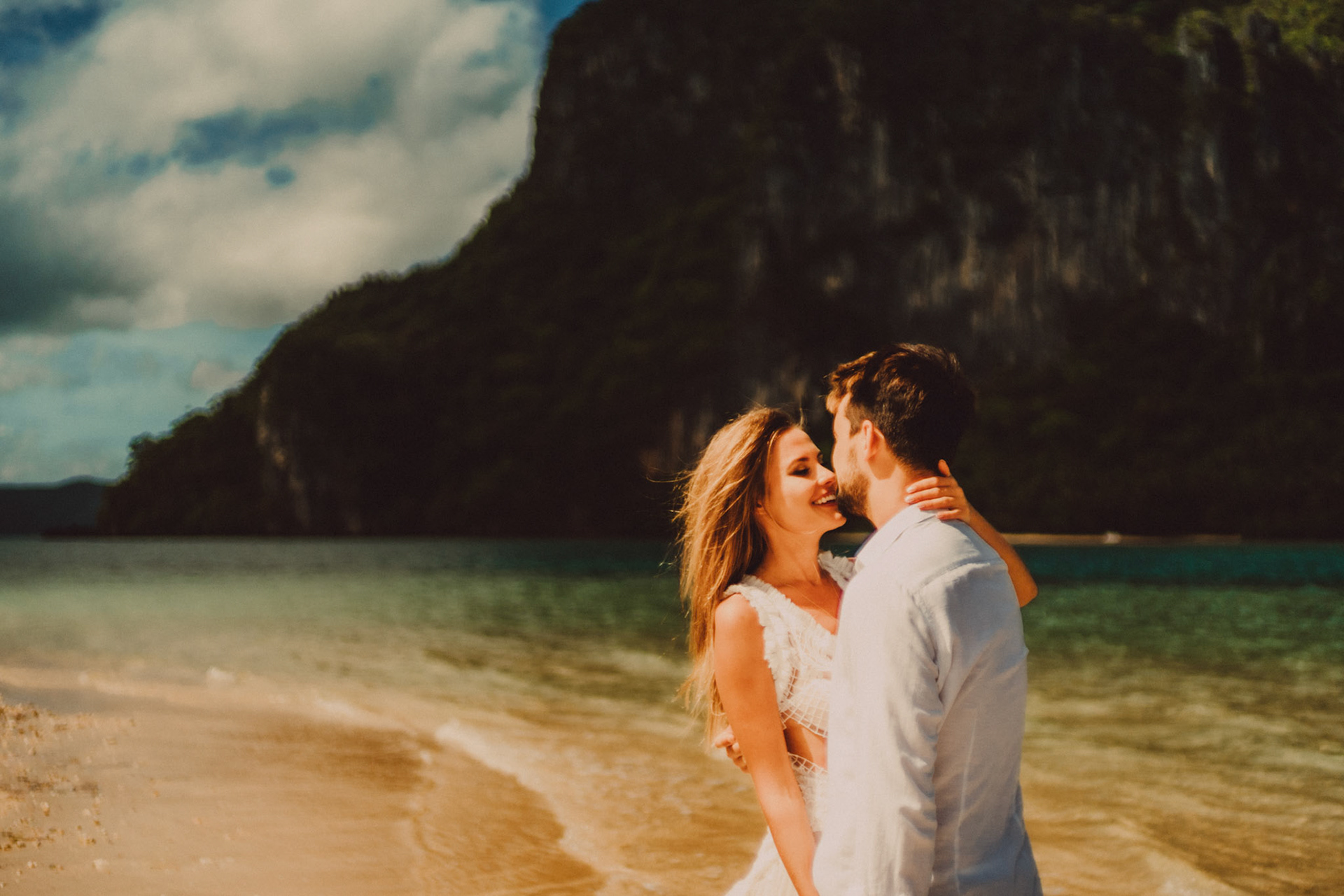 A honeymoon couple shoot in Lagen Island's sandbar on a bright and sunny morning, El Nido, Palawan, Philippines, Southeast Asia, December 2019, Sony A7III.