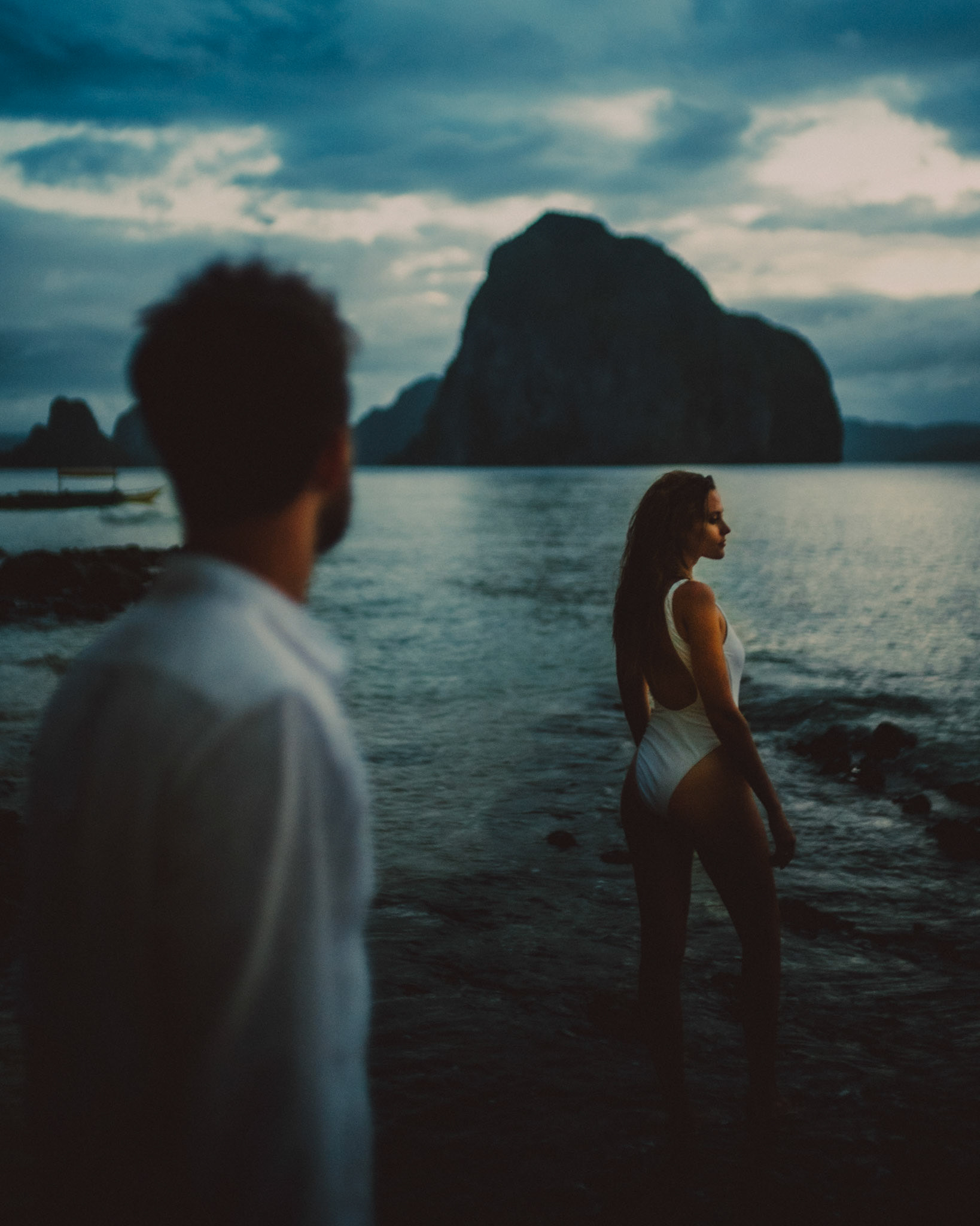 Moody and intimate couple portraits during blue hour in Las Cabanas Beach, El Nido, Palawan, Philippines, Southeast Asia, December 2019, Sony A7III.