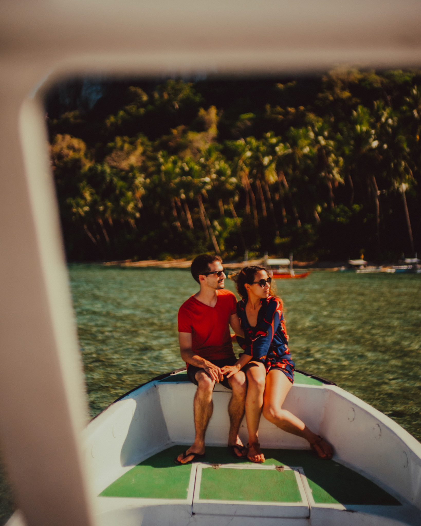 Couple portraits on a speedboat approaching Bukal Beach's idyllic cove, Cadlao Island, El Nido, Palawan, Philippines, Southeast Asia, April 2019, Sony A7III.