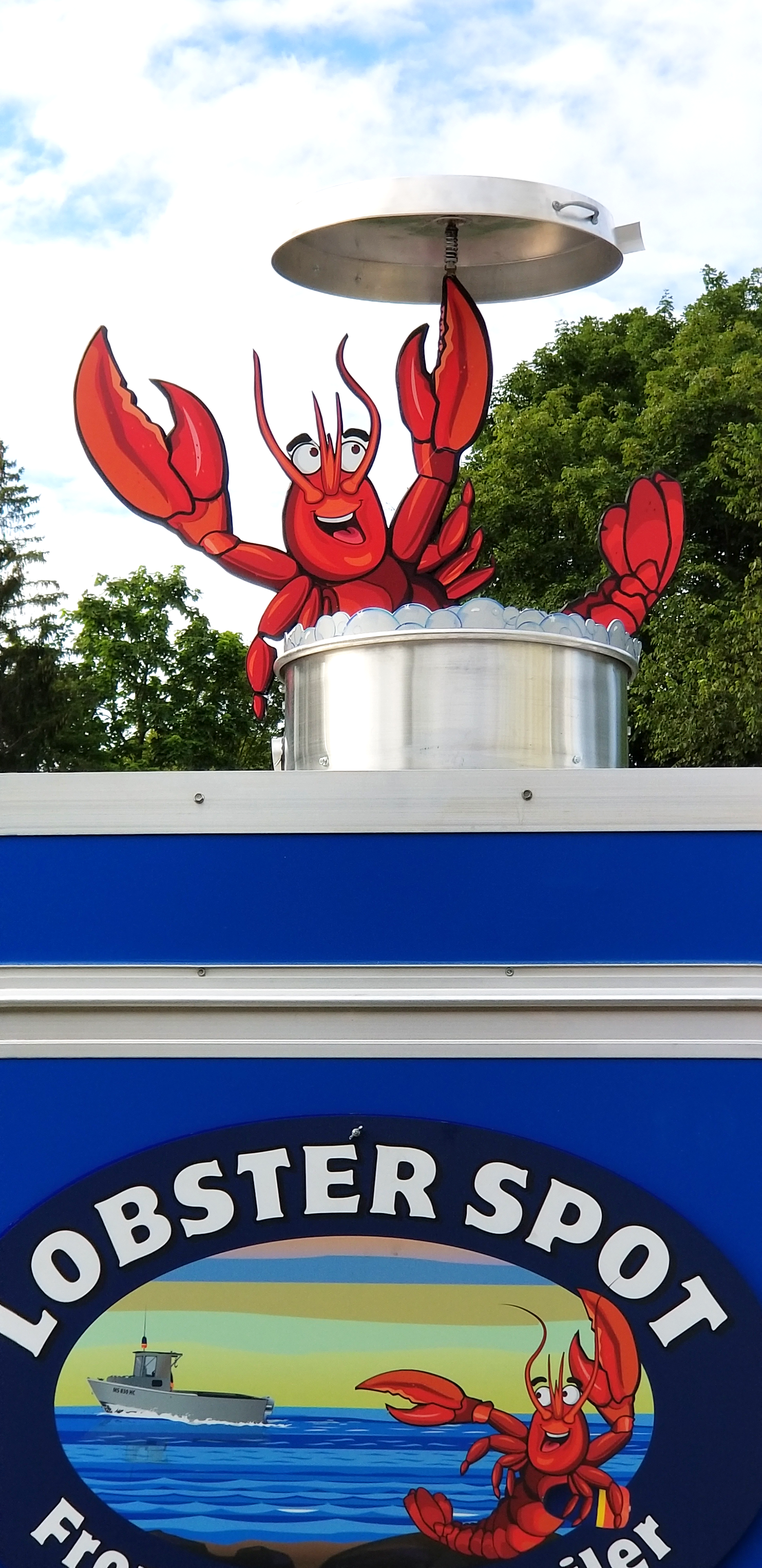 Picture of final install of 3D lobster spot mascot with spinning pot cover