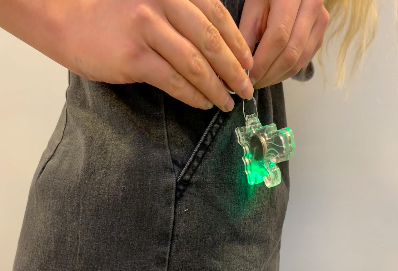 The Plod being attached to the user to track steps.