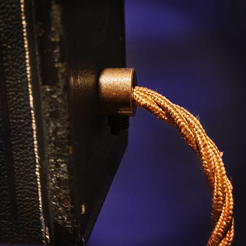 Antique style cord grip with vintage braided cable