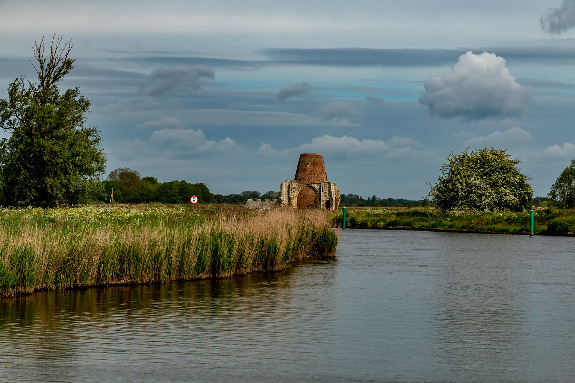 The former gatehouse of St Benet's Abbey, with the later wind pump built into it's remains, comes into view