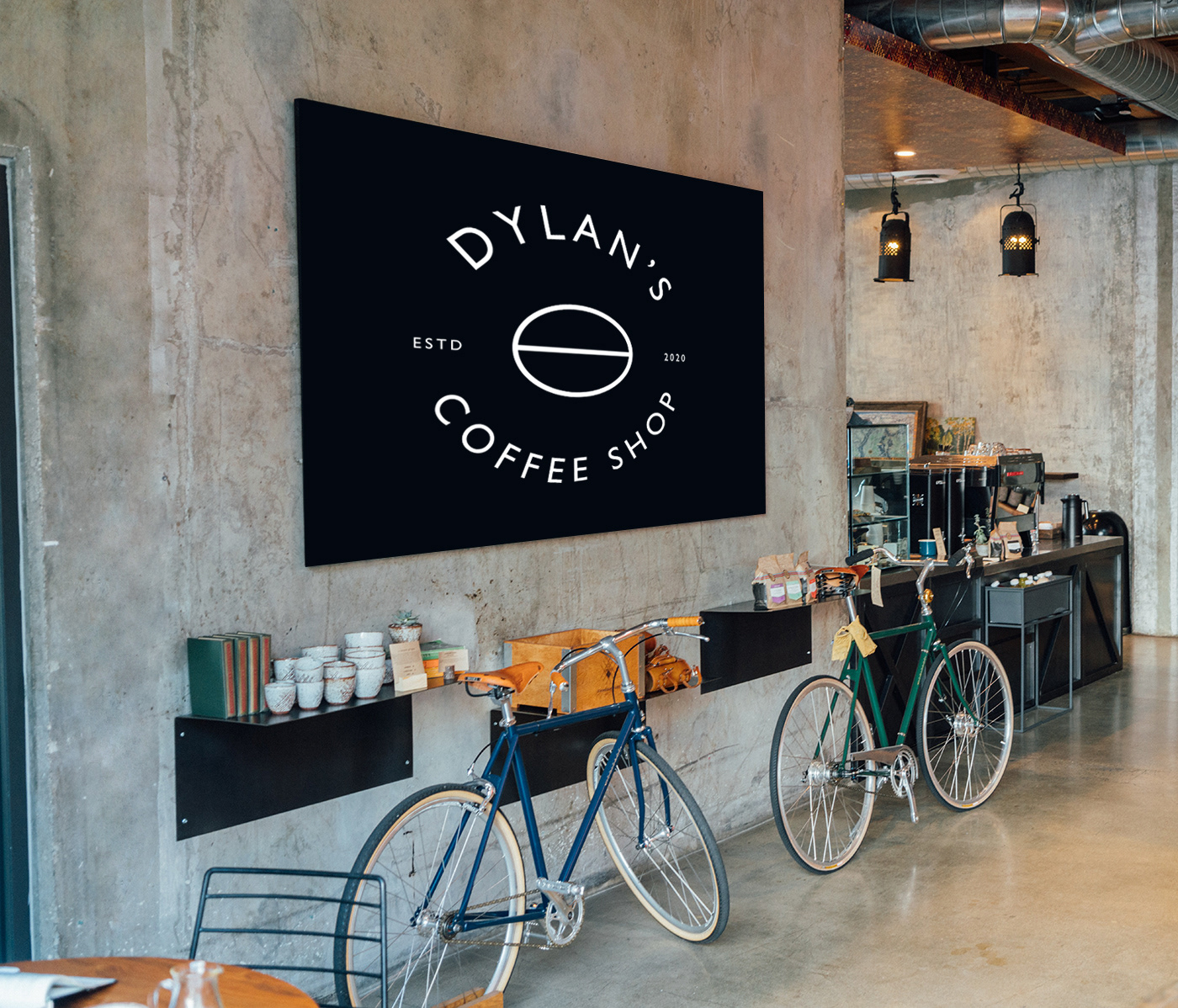 Lindsey Ahmet graphic designer - Dylan's Coffee shop branding design main logo design in black and white on a large black sign inside the coffee shop