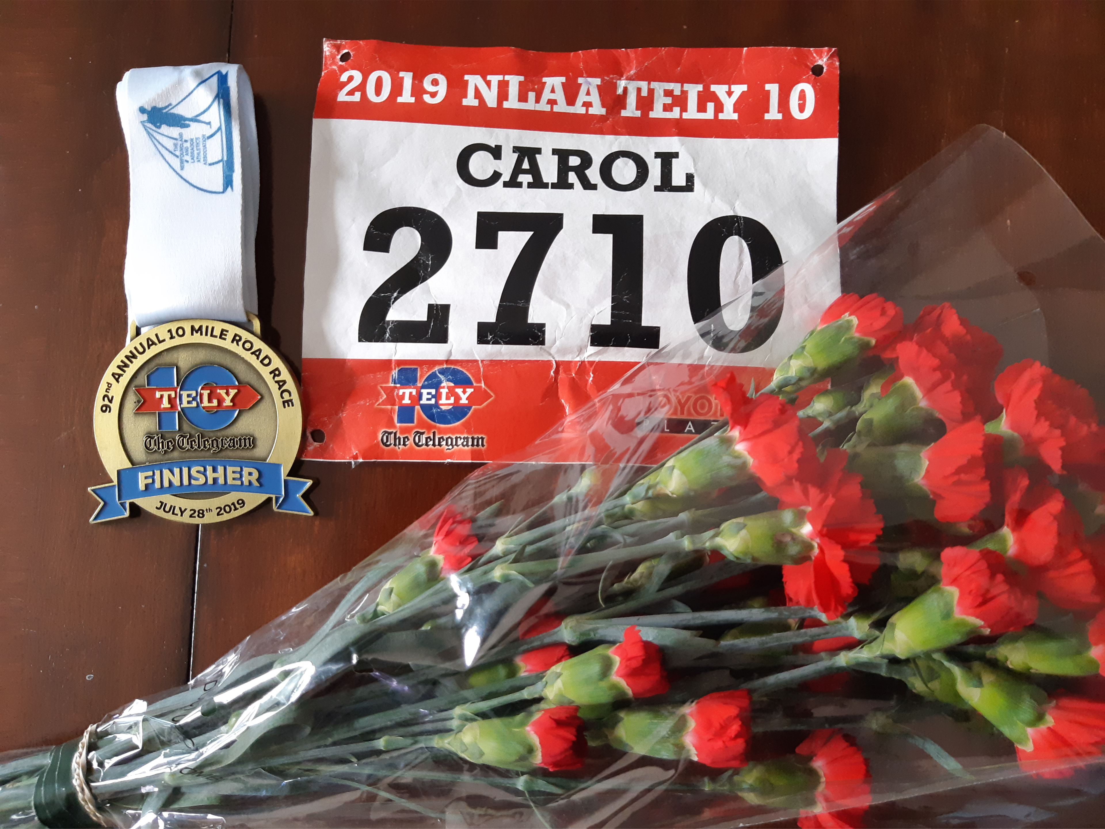 tely 10 bib medal and flowers