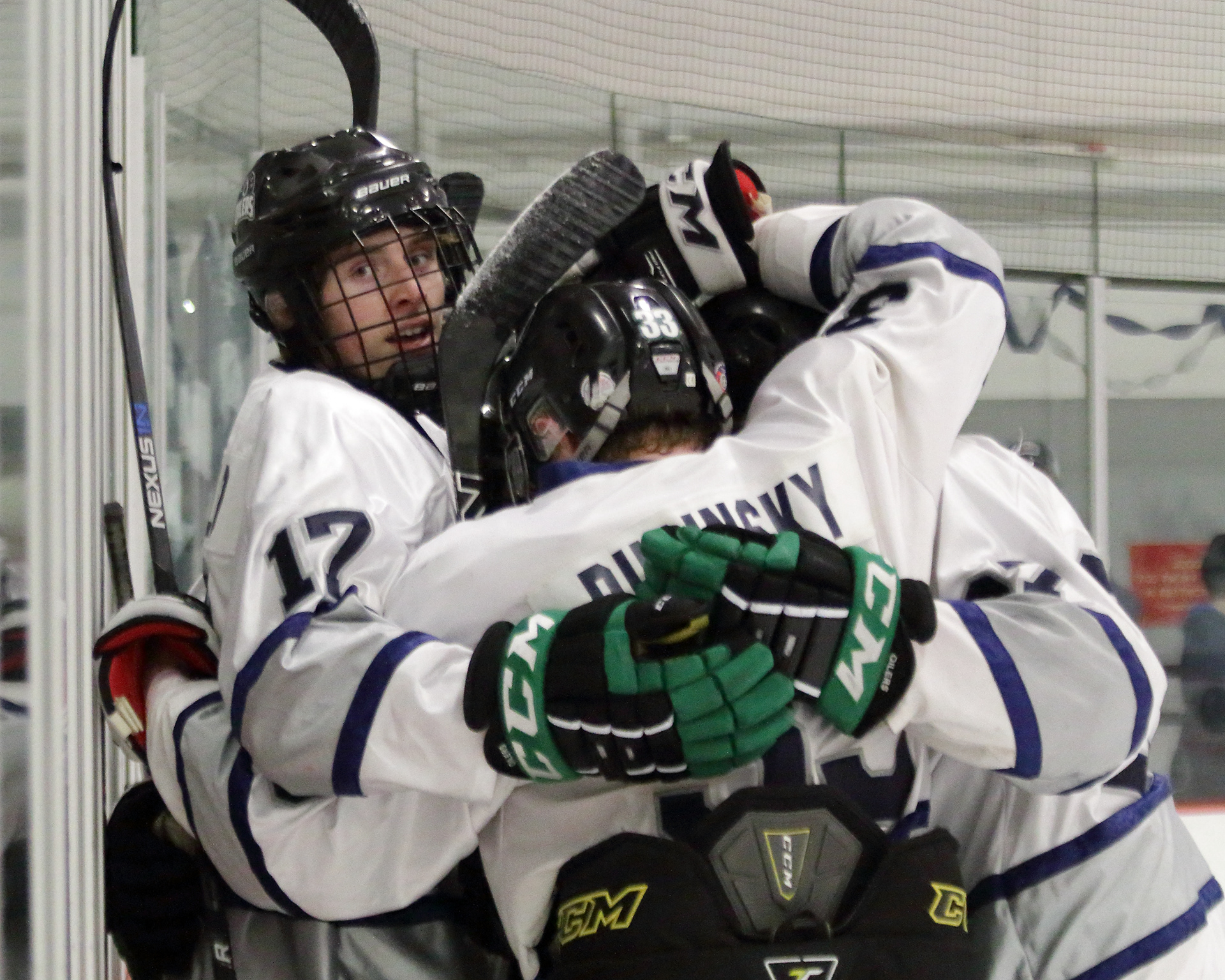Eagle River High School’s, Sutton McDonald, 12 is hugged by his teammates after scoring a goal on January 23, 2017 at the McDonald Center. 
