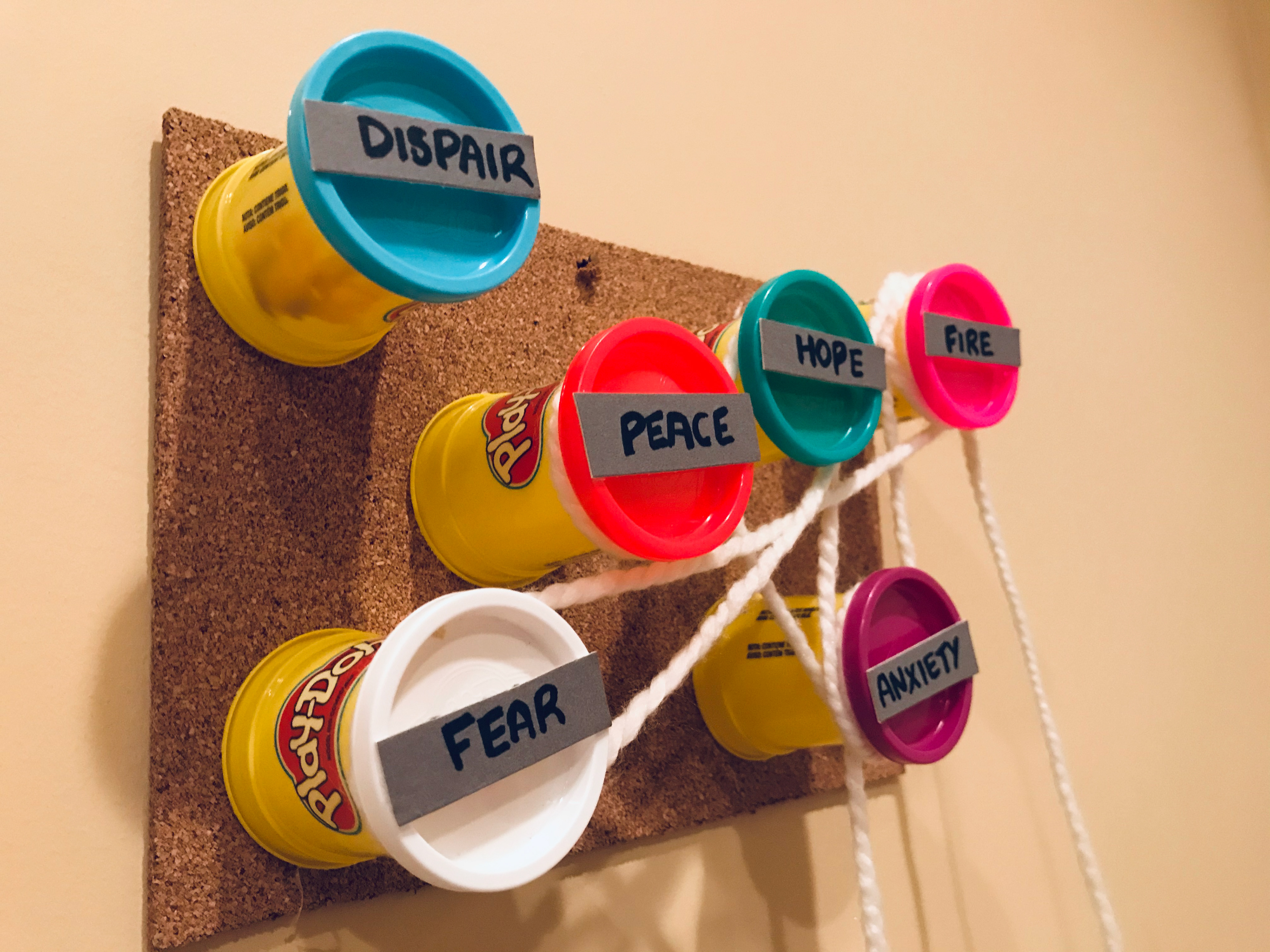 Prototype with empty PlayDoh containers