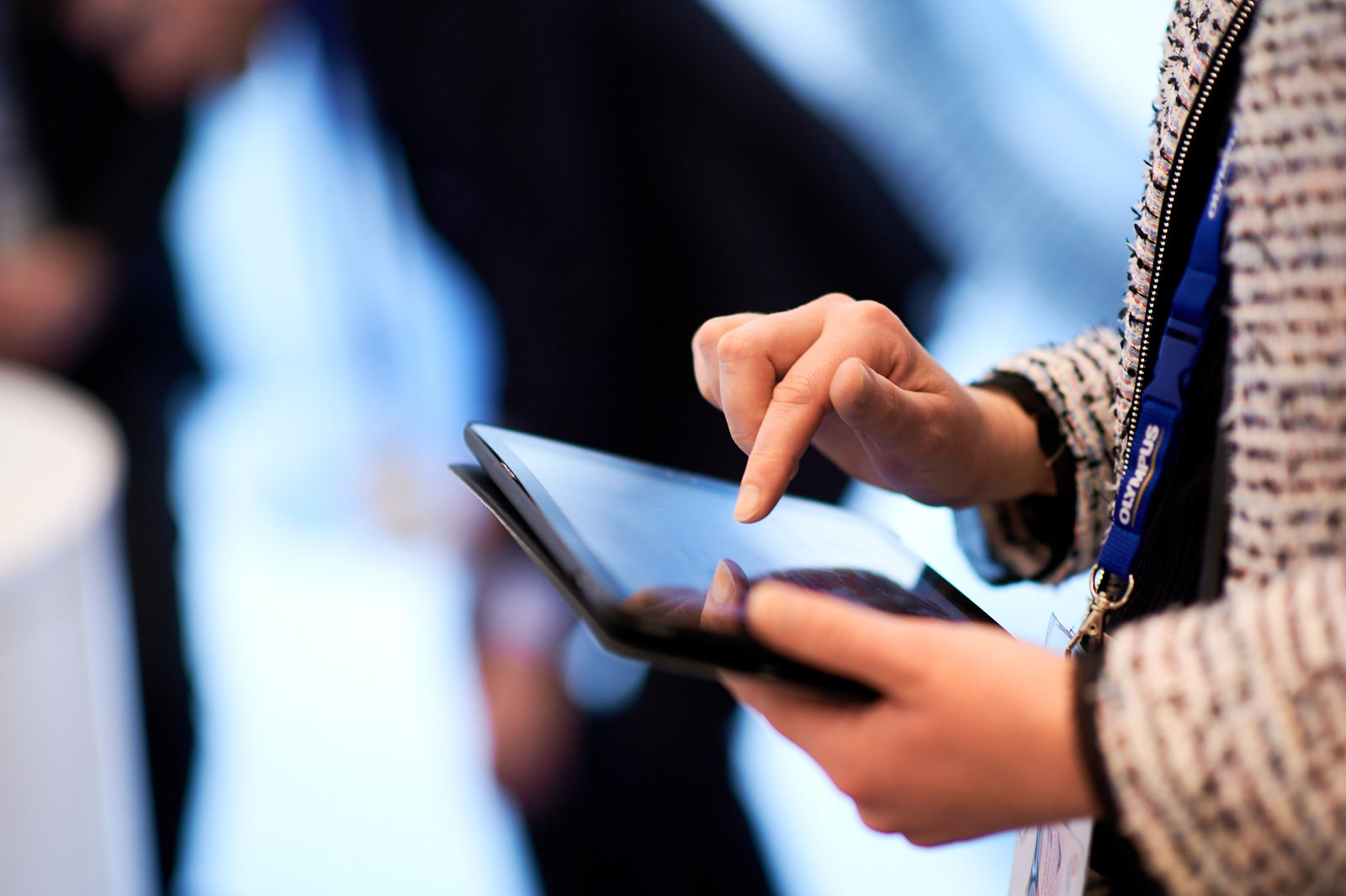 Convention attendee using her tablet