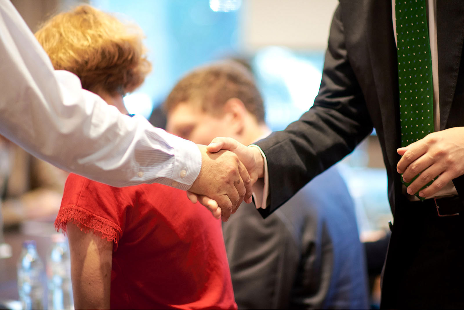 photo of a handshake at a business conference in Vienna