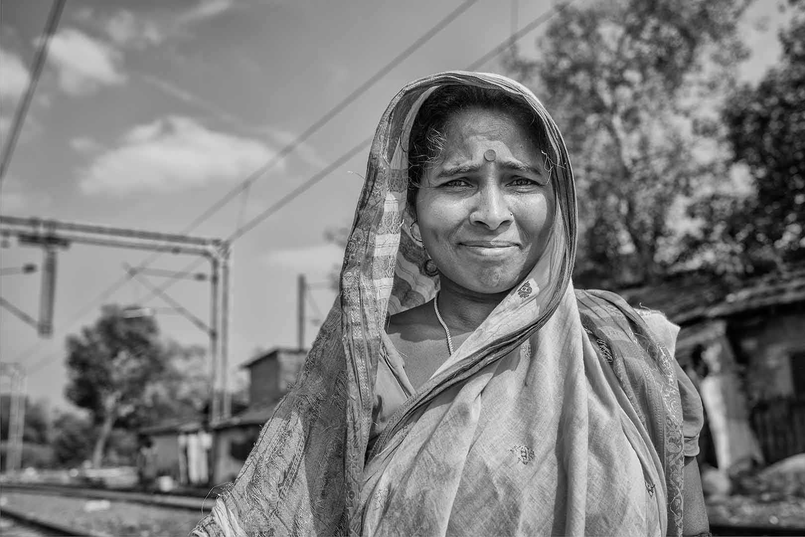 Portriat of a lady standing on the railway tracks