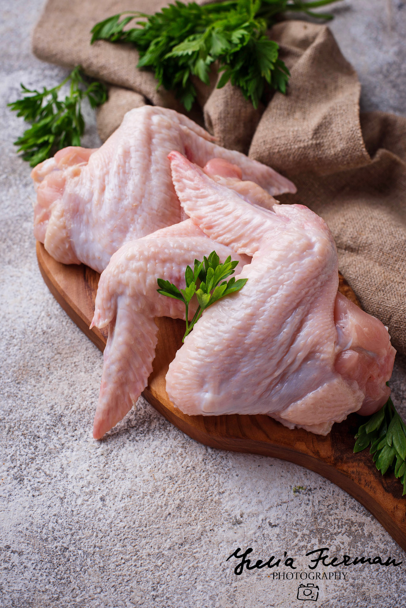 Raw chicken wings on cutting board. Selective focus