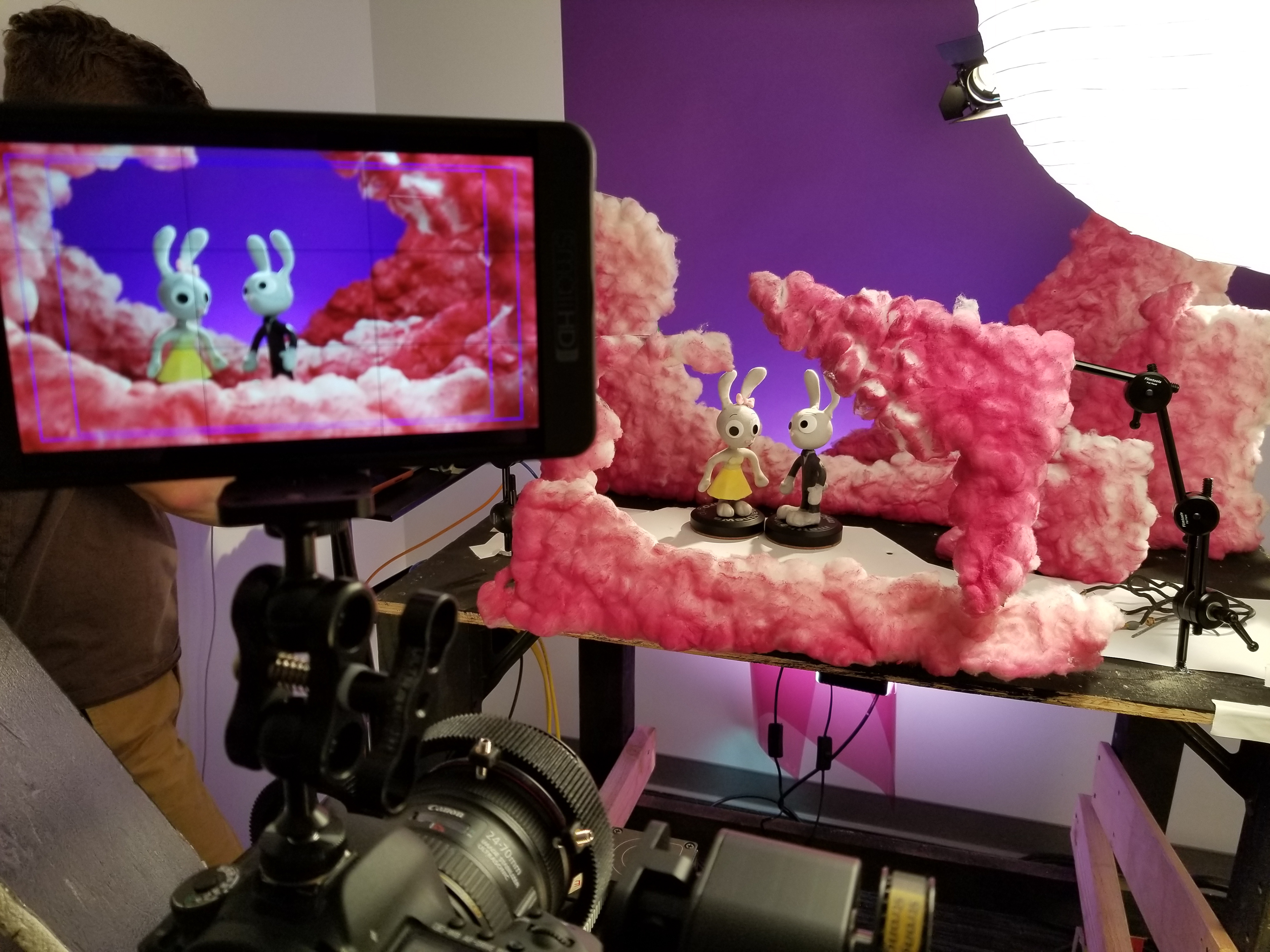 The "clouds" are cotton balls glued to foam board and then spray-painted.