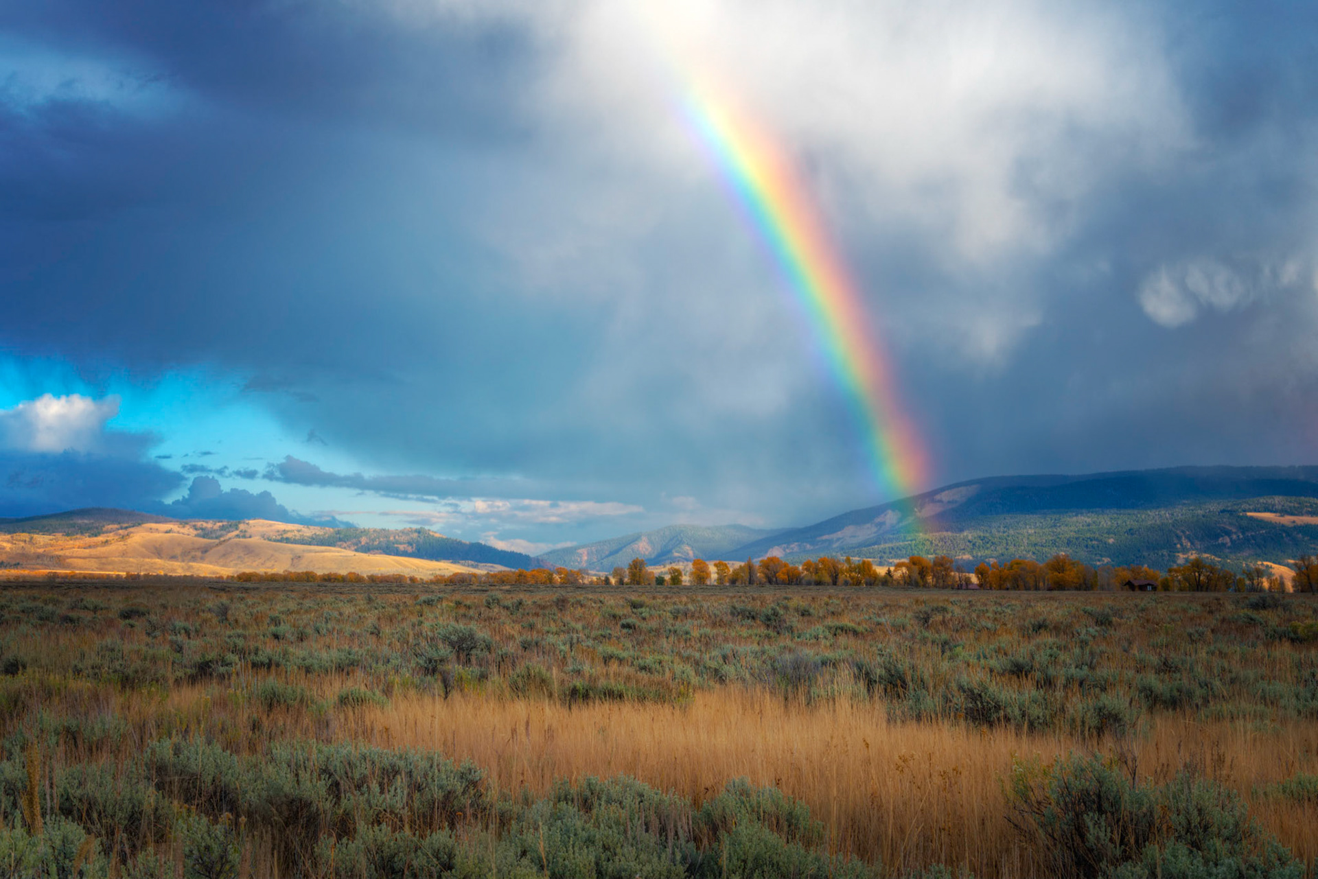 A rainbow over Antelope Flats after an afternoon storm.Grand Teton National ParkWyomingSeptember 30, 2016This is an HDR image consisting of 5 exposures merged in Photomatix Pro. Additional processing in Lightroom and Photoshop.PENTAX K-1, TAMRON 28-300mm F3.5-6.3 Ultra zoom XRISO 100 45 mm  ⅛ sec at ƒ / 16