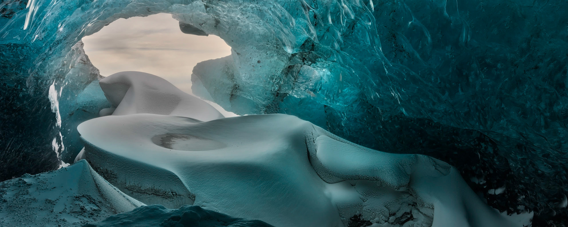 The entrance to an ice cave under Vatnajökull.  The winds outside were blowing at gale force speeds, while inside, it was calm.  Austurland, IcelandFebruary 1, 2016This is an HDR panoramic image consisting of 3 frames comprised of 5 exposures each. HDR processing performed in Photomatix Pro.  Panoramic stitching performed in Photoshop. Additional processing performed in Lightroom and Photoshop.PENTAX K-3, Sigma 18-35mm f/1.8 DC HSM ArtISO 100 18 mm  ⅙ sec at ƒ / 16