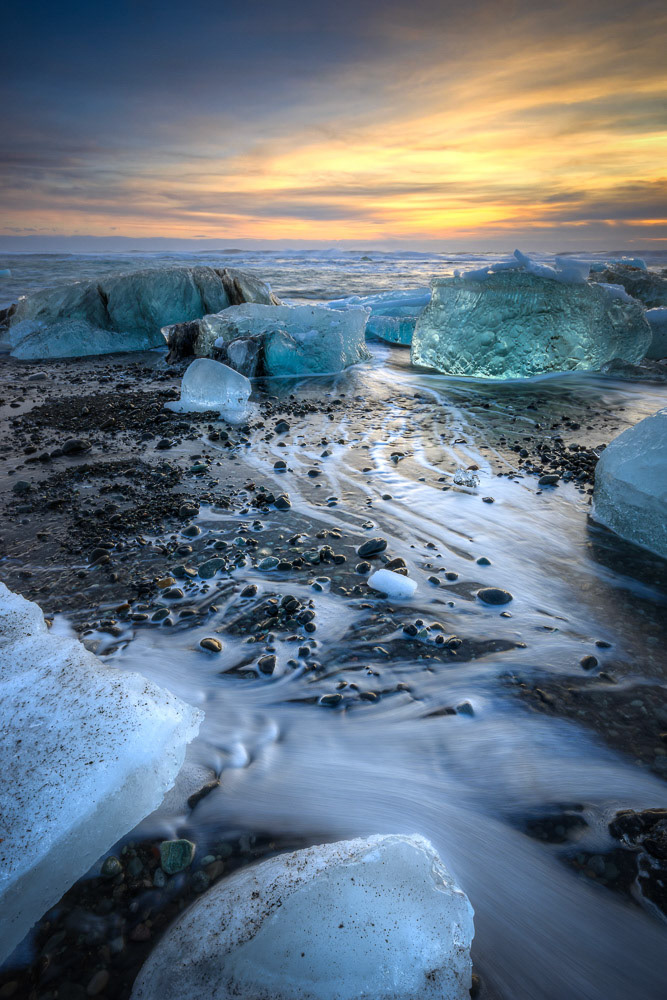 Sunrise at the ice beach at the outlet of Jökullsárlón.Austurland, IcelandFebruary 2, 2016This is an HDR image consisting of 5 exposures merged in Photomatix Pro. Additional processing in Lightroom and Photoshop.PENTAX K-3, Sigma 10-20mm f/4-5.6 EX DCISO 100 13 mm  ⅕ sec at ƒ / 16