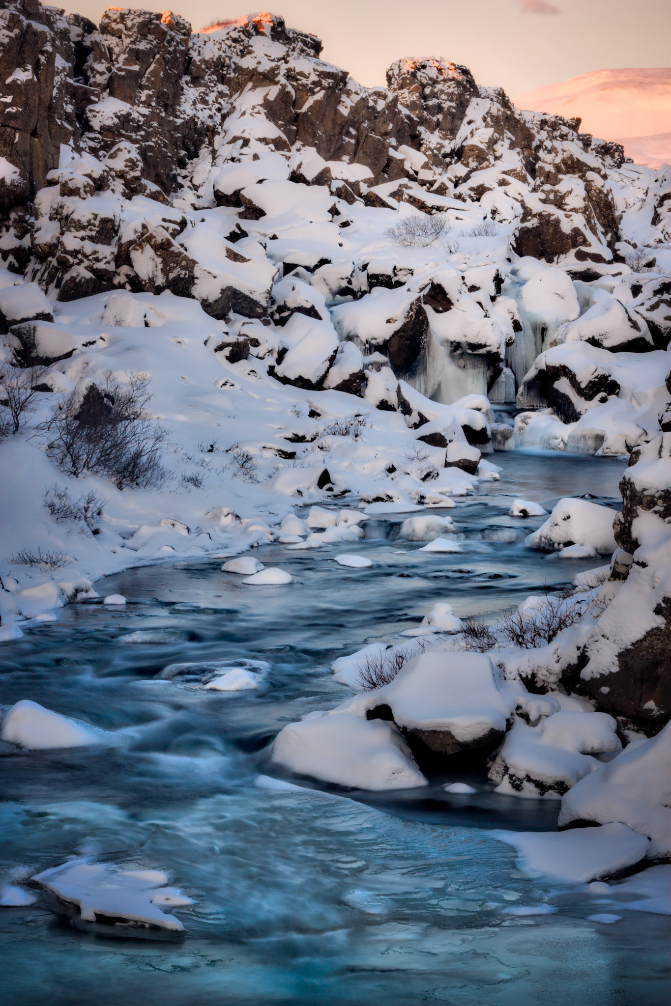 The Öxará River, continuing its journey off of the North American tectonic plate into the lake of Þingvallavatn.Þingvellir National ParkSuðerland, IcelandJanuary 30, 2016This is an HDR image consisting of 5 exposures merged in Photomatix Pro. Additional processing in Lightroom and Photoshop.PENTAX K-3, Sigma 18-250mm f/3.5-6.3 DC OS HSMISO 100 53 mm  0.6 sec at ƒ / 16