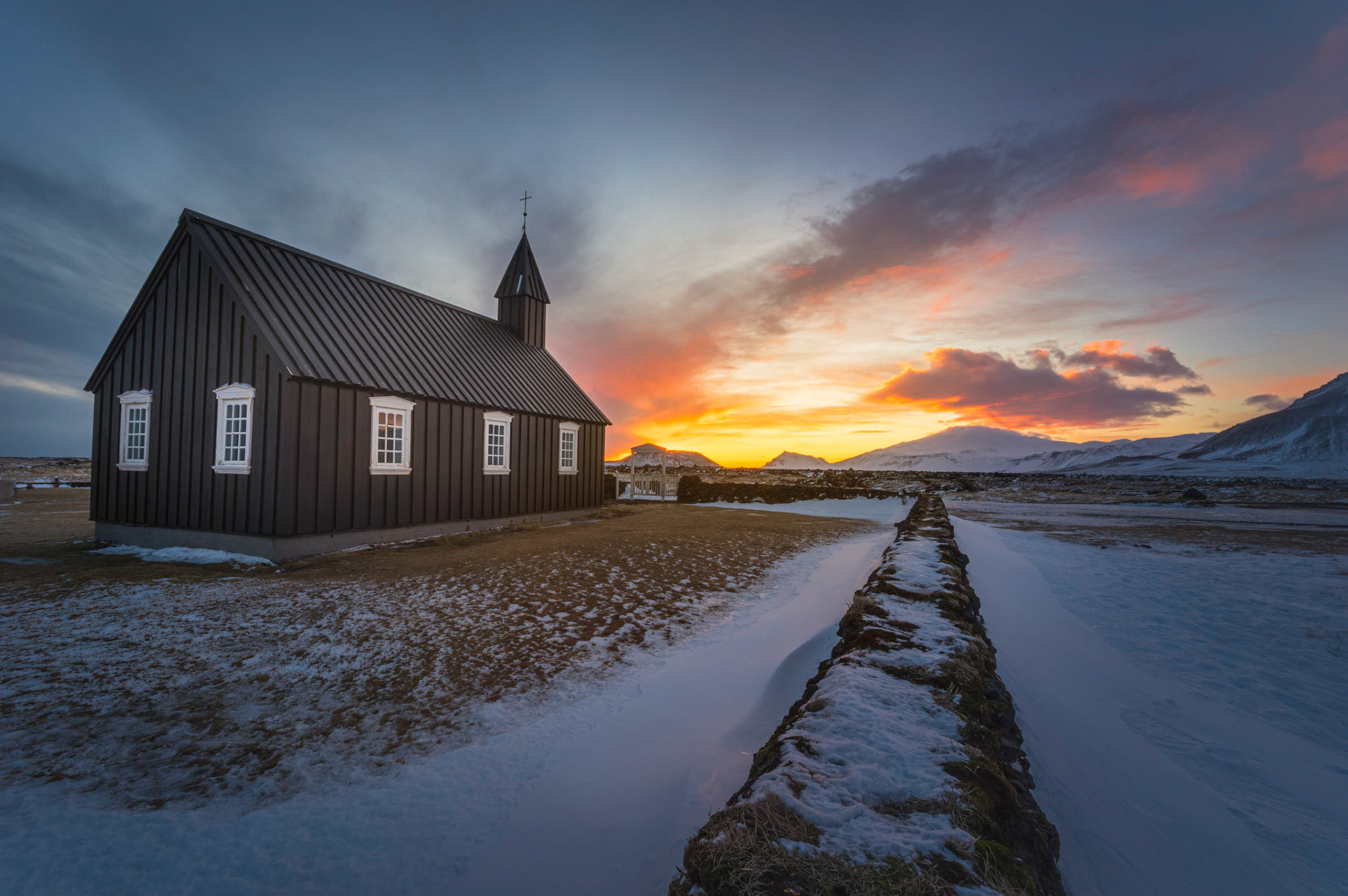 Sunset at the black church of BúðirVesturland, IcelandFebruary 6, 2016This is an HDR image consisting of 5 exposures merged in Lightroom. Additional processing in Lightroom and Photoshop.Pentax K-3, Sigma 10-20mm f/4-5.6 EX DCISO 100 10 mm  ⅕ sec at ƒ / 22