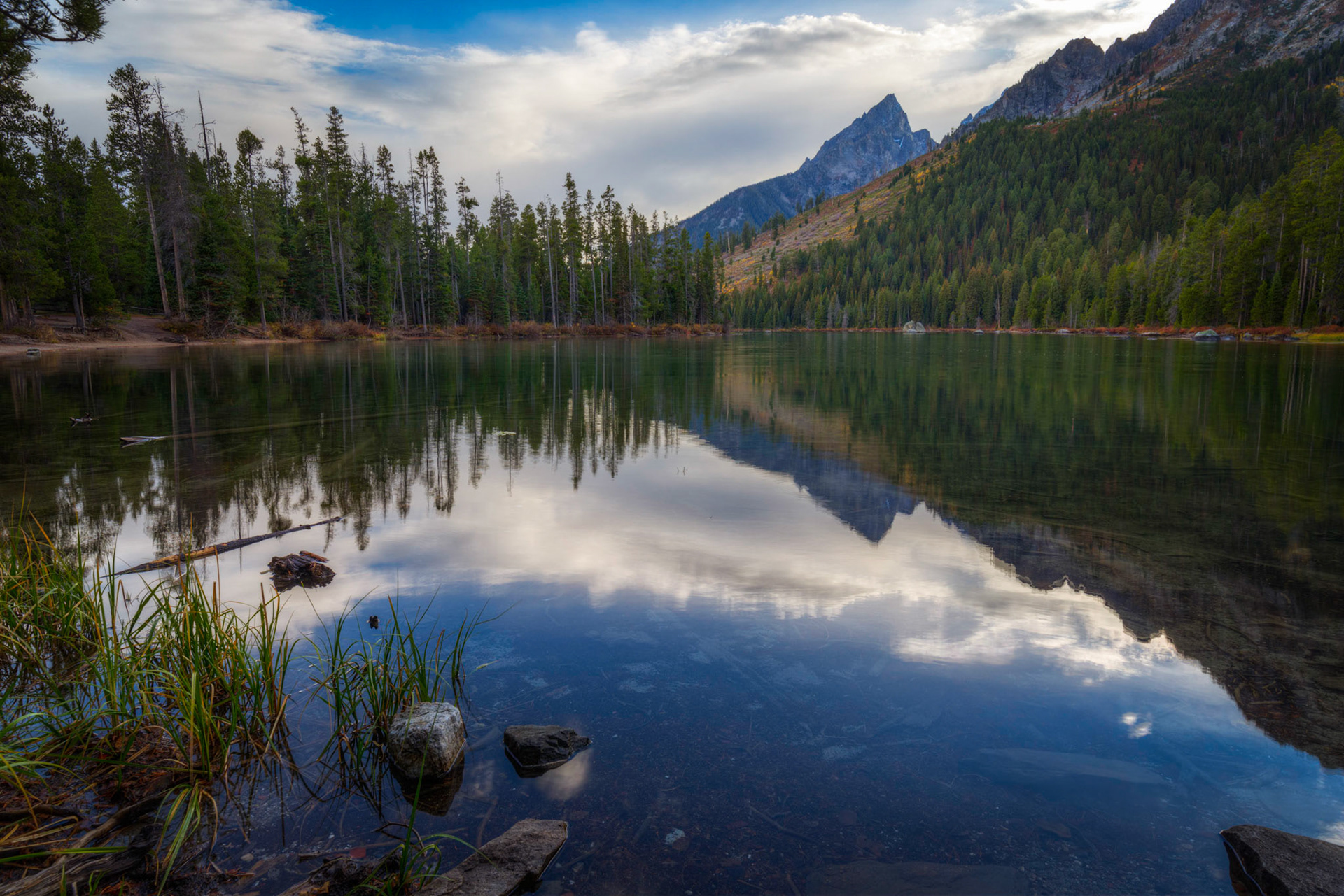 Afternoon reflections from the shore of String Lake.Grand Teton National ParkWyomingSeptember 30, 2016This is an HDR image consisting of 5 exposures merged in Photomatix Pro. Additional processing in Lightroom and Photoshop.PENTAX K-1, HD PENTAX-D FA 15-30mm F2.8ED SDM WRISO 100 21 mm  ¹⁄₁₅ sec at ƒ / 16