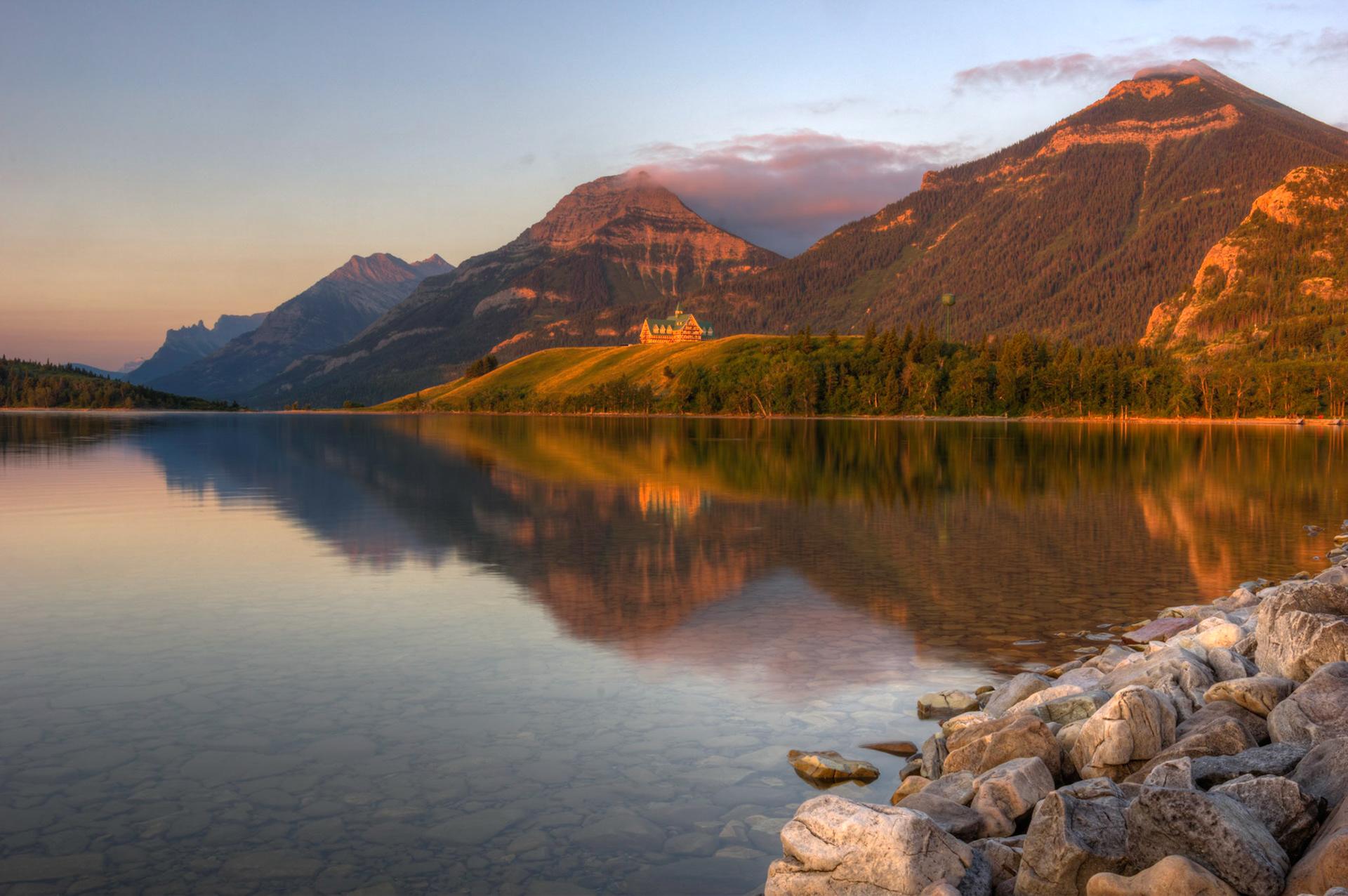 Sunrise at Middle Waterton Lake.Waterton Lakes National ParkAugust 2, 2015This is an HDR image consisting of 5 exposures merged in Photomatix Pro. Additional processing in Lightroom and Photoshop.PENTAX K-3, Sigma 18-35mm f/1.8 DC HSM ArtISO 100 23 mm  0.5 sec at ƒ / 16