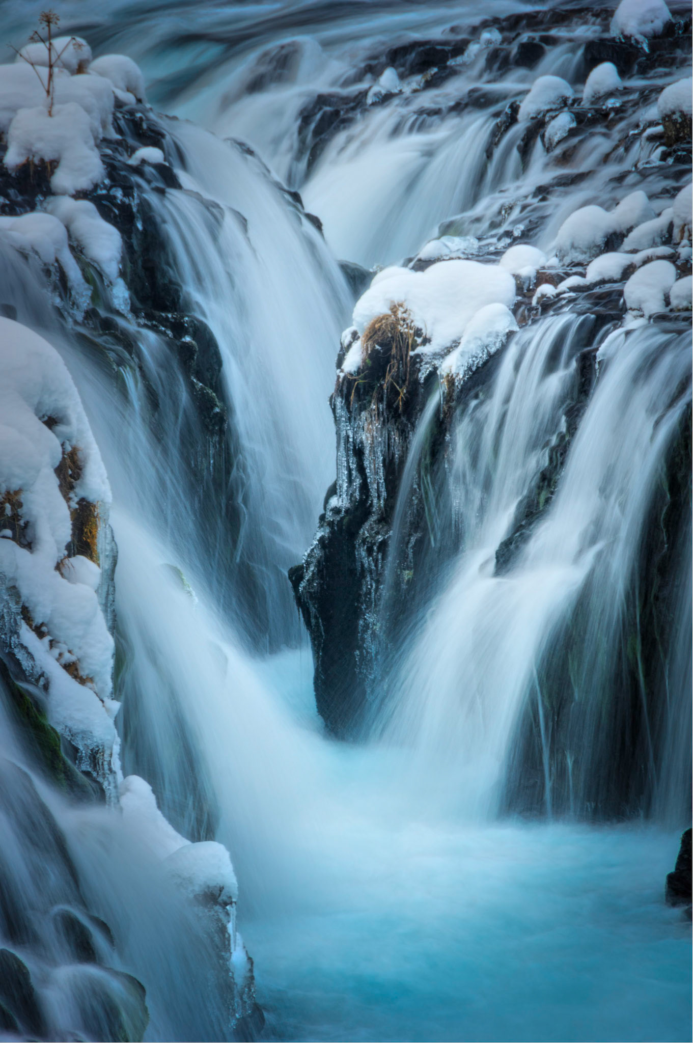 Long lens image of Brúarfoss, on the Brúará River, near Brekkuskógur, Iceland.Suðerland, IcelandJanuary 29, 2016This is an HDR image consisting of 3 exposures merged in Photomatix Pro. Additional processing in Lightroom and Photoshop.PENTAX K-3, Sigma 18-250mm f/3.5-6.3 DC OS HSMISO 100 210 mm  ⅙ sec at ƒ / 11