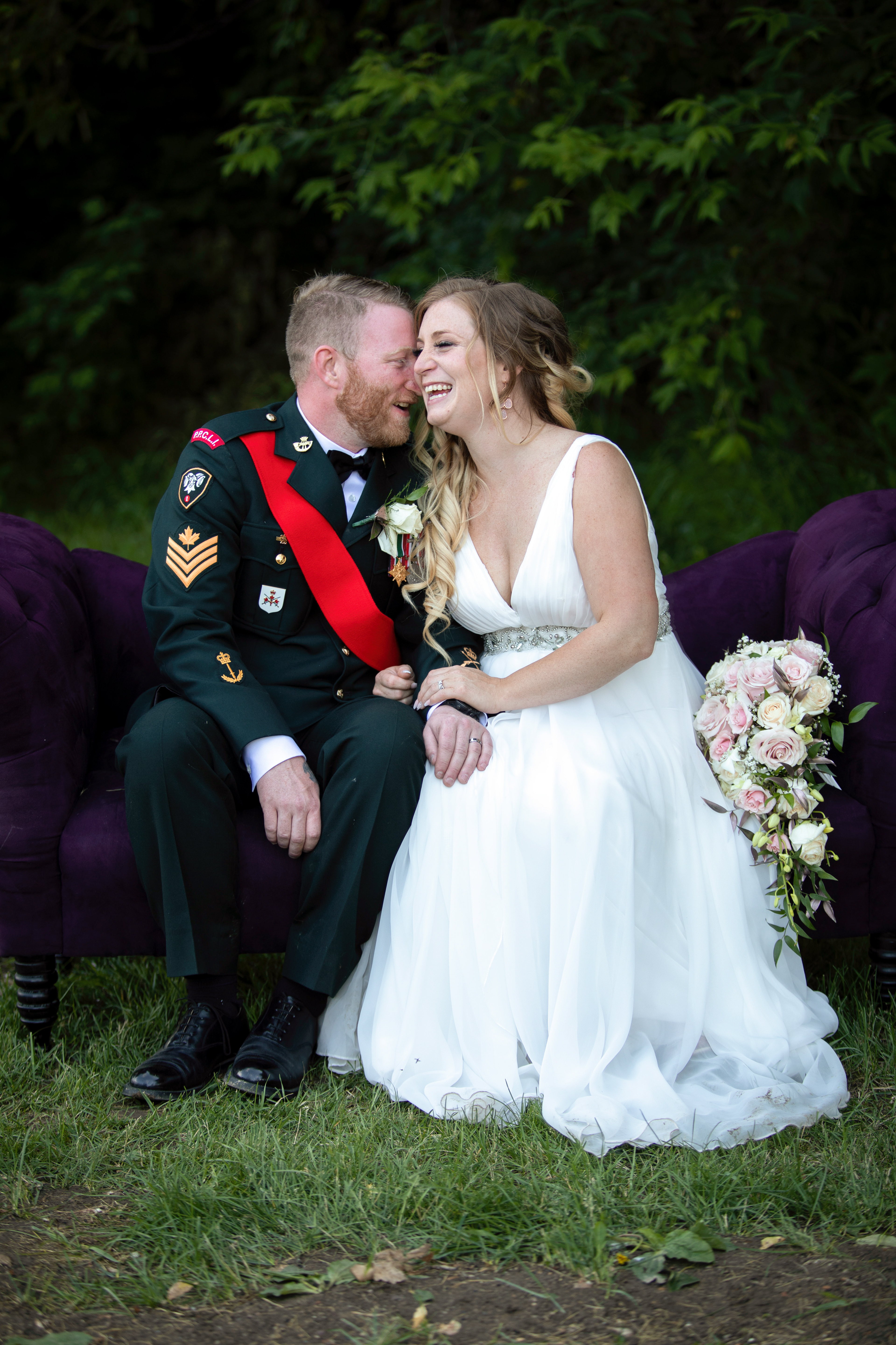 Bride and groom in summer on a couch in Edmonton
