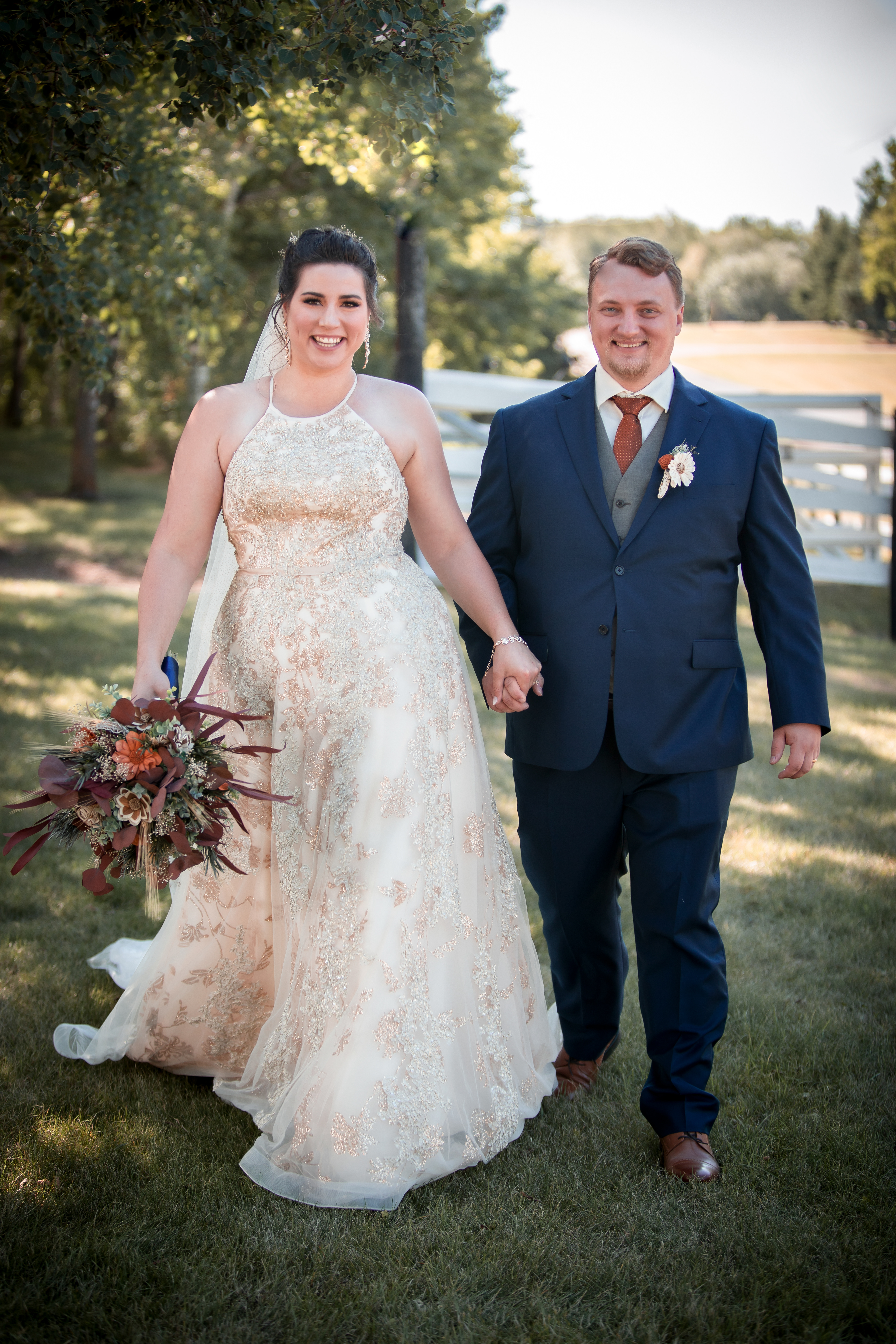 Wedding couple laughing and walking