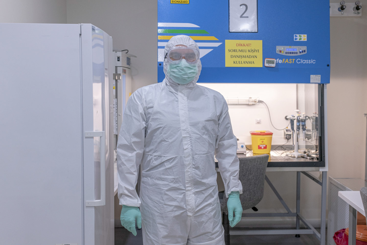 A molecular biologist in the high safety laboratory chamber at a private hospital in Istanbul on 1 May 2020.