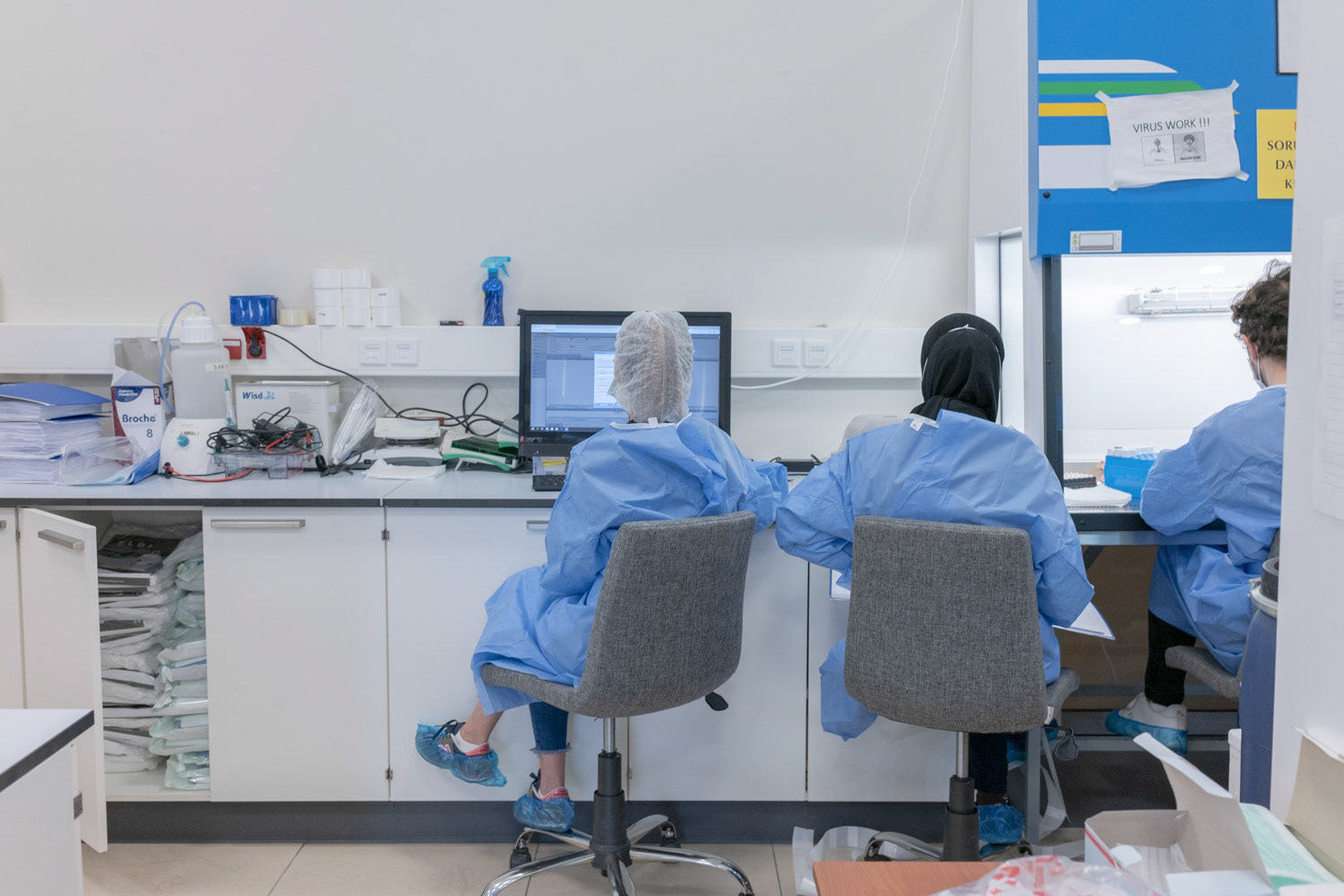 Nurses wearing protective equipments as they register the brought patient samples to a common public server at a private laboratory of hospital in Istanbul on 1 May 2020.