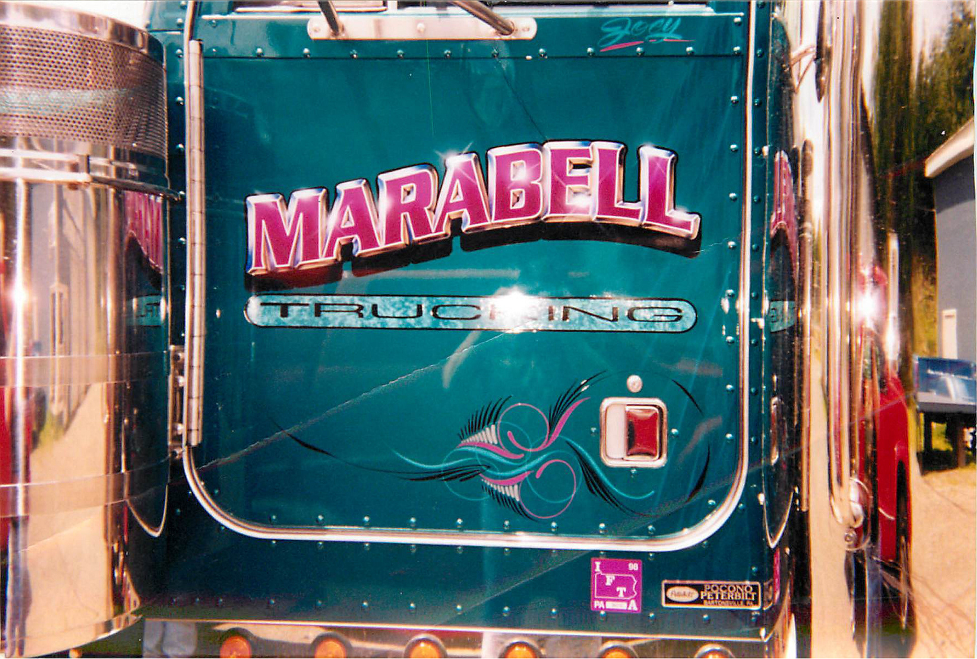Hand-painted, airbrushed truck lettering with pinstriping