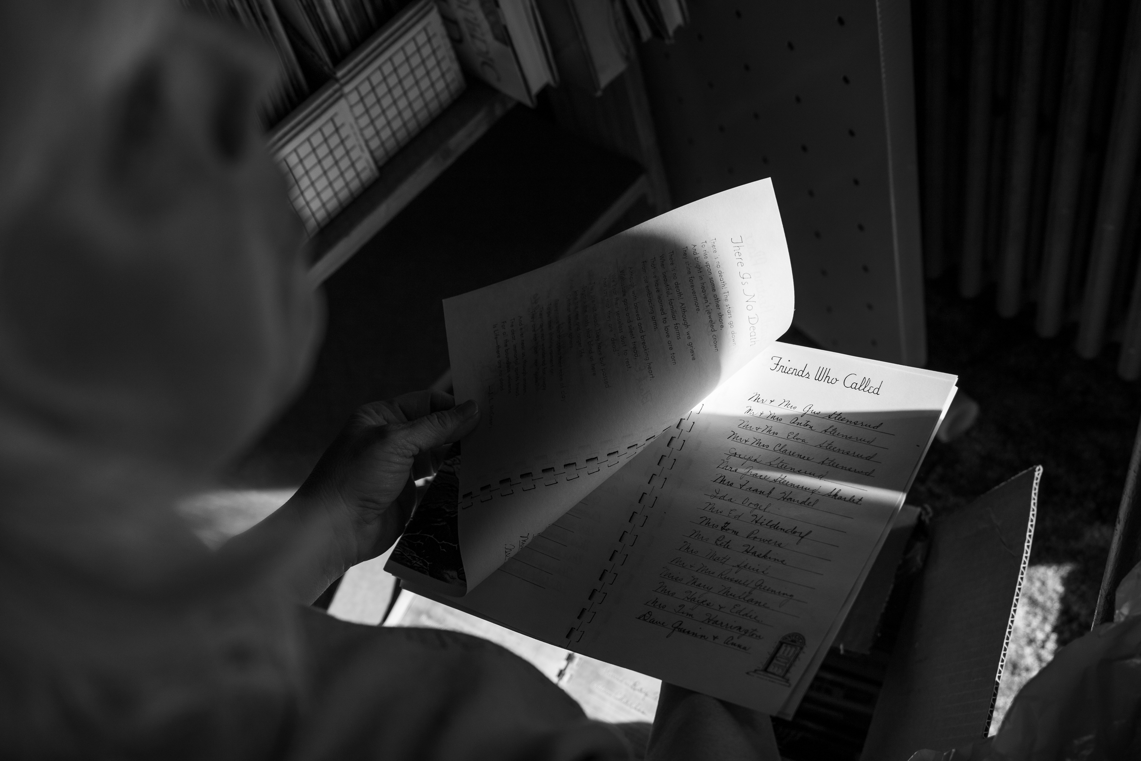 Teresa Travis glances at old memories as she sorts through papers.
