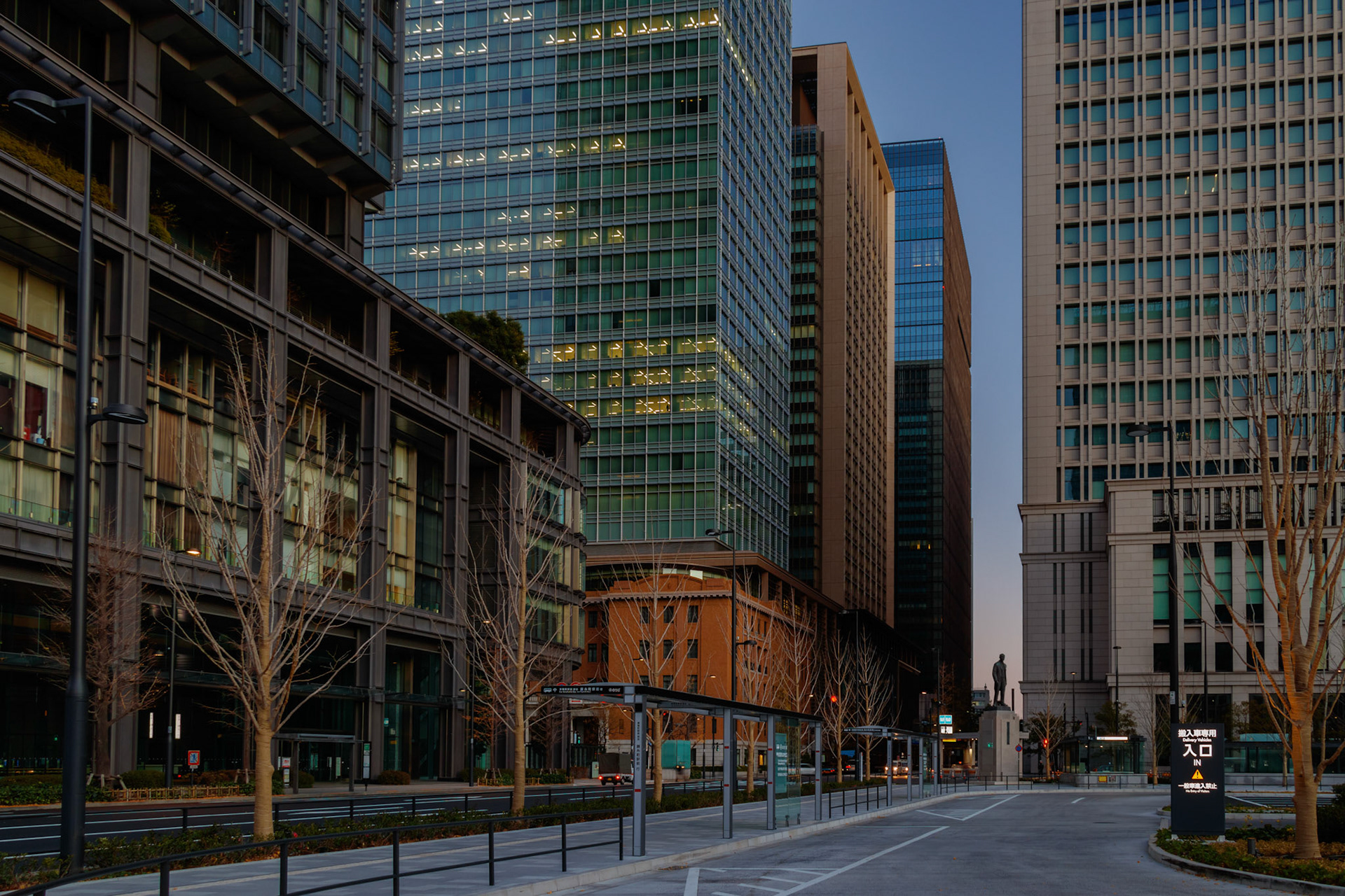 Street view of Tokyo Station at dawn. Illuminated buildings gives us warm feelings. This image was taken in December 2017, Tokyo, Japan.