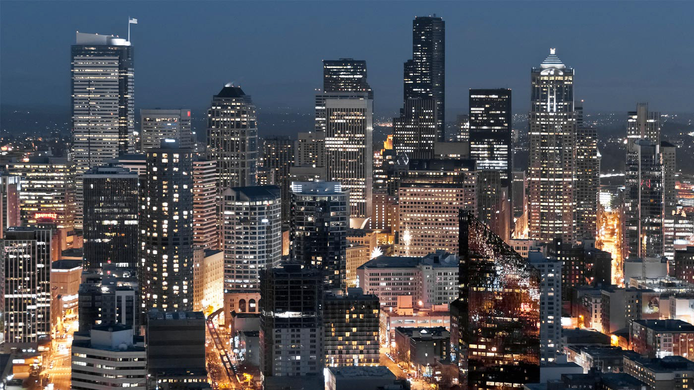 Seen from the Space Needle, the lights of downtown Seattle sparkle brightly at twilight