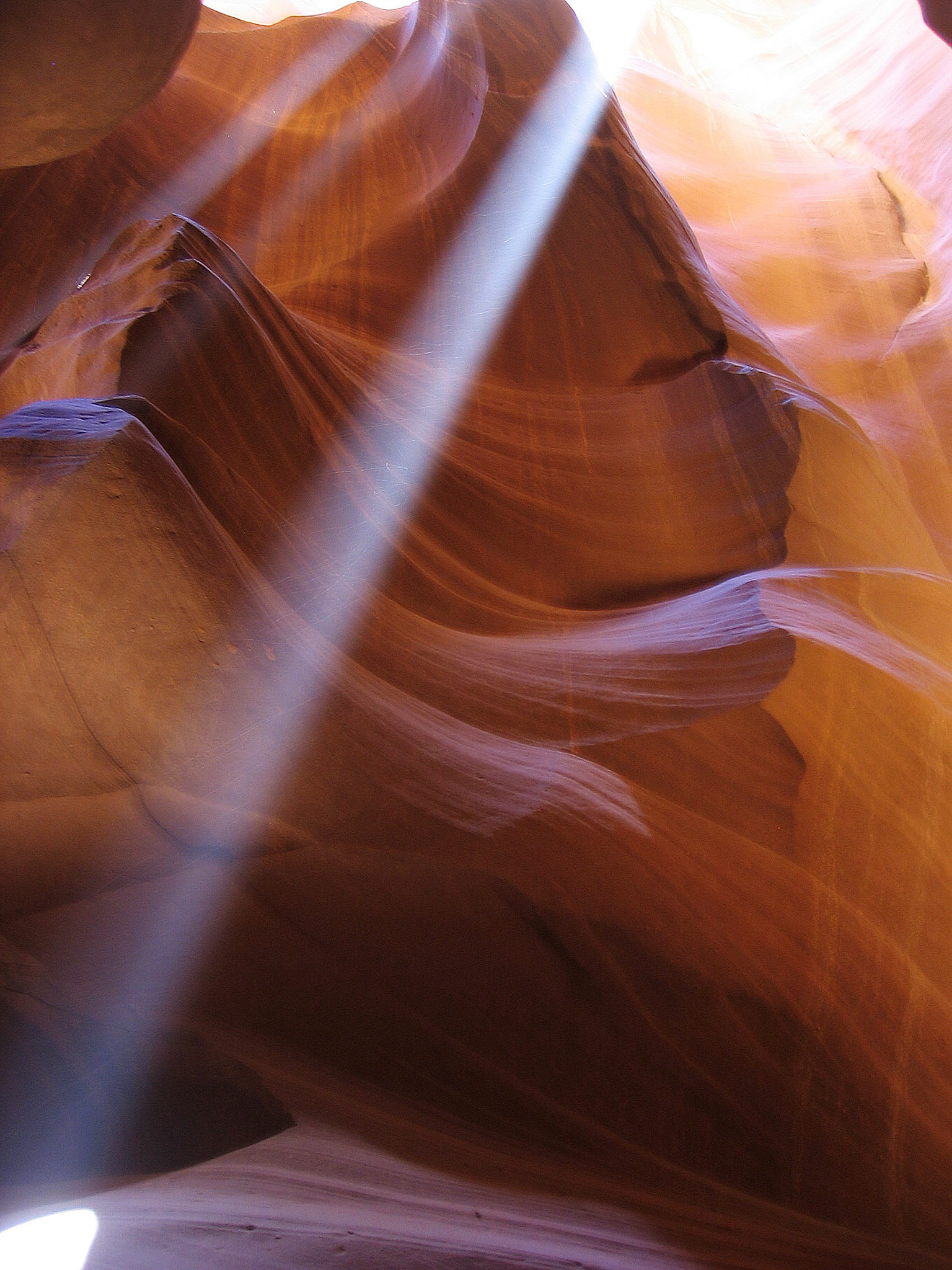 Over 4th of July weekend we went on a road trip to Utah and Arizona. We stopped at Antelope Canyon which is on Navajo land. This is one shot I took of the beams of sunlight that penetrate the narrow canyon.
